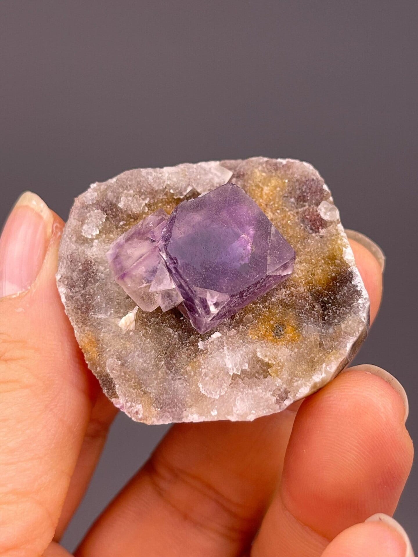 Purple CaF₂ fluorite with phantom growth frame on matrix