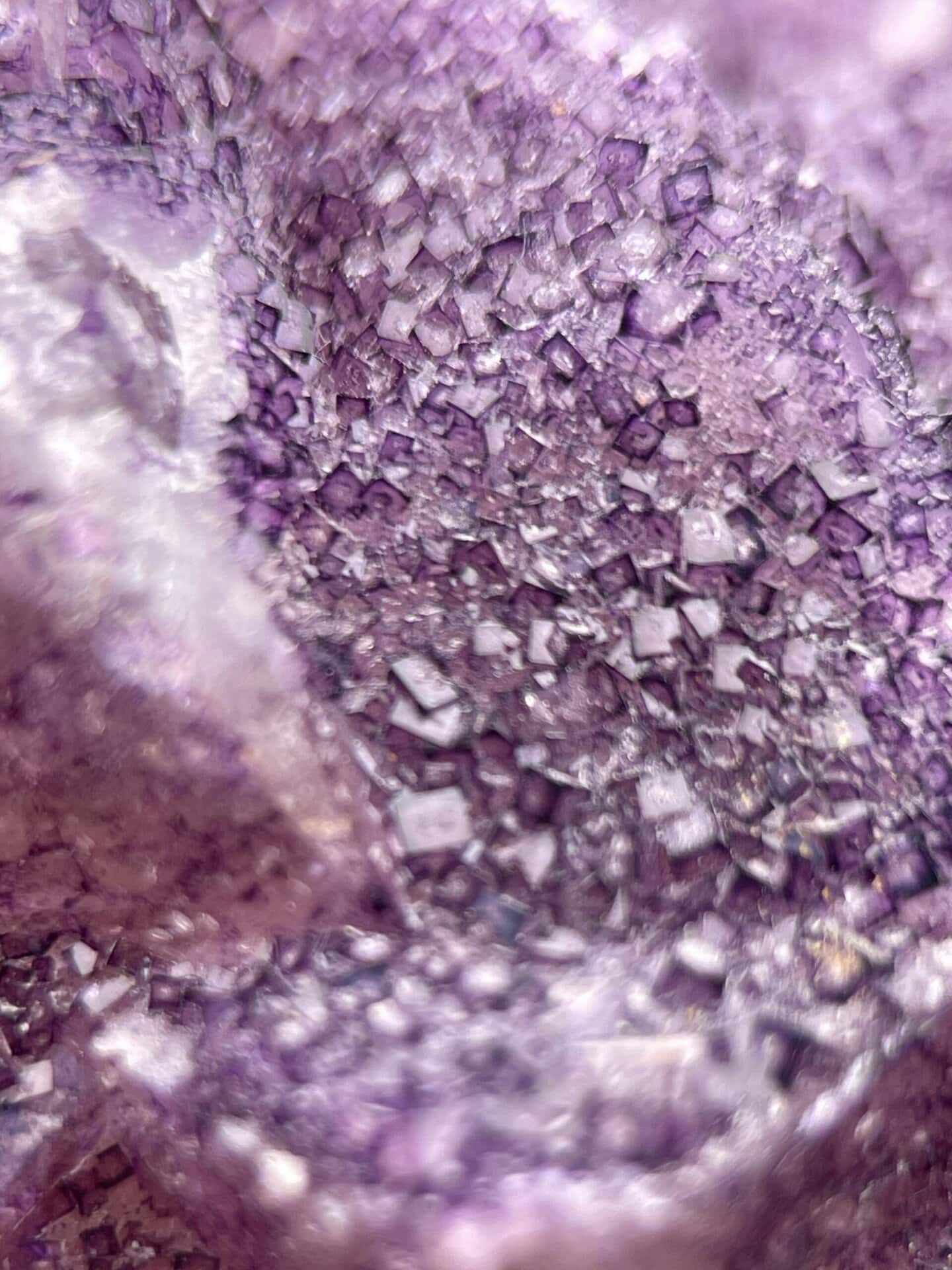 Rich purple CaF₂ fluorite with complex crystal surface detail