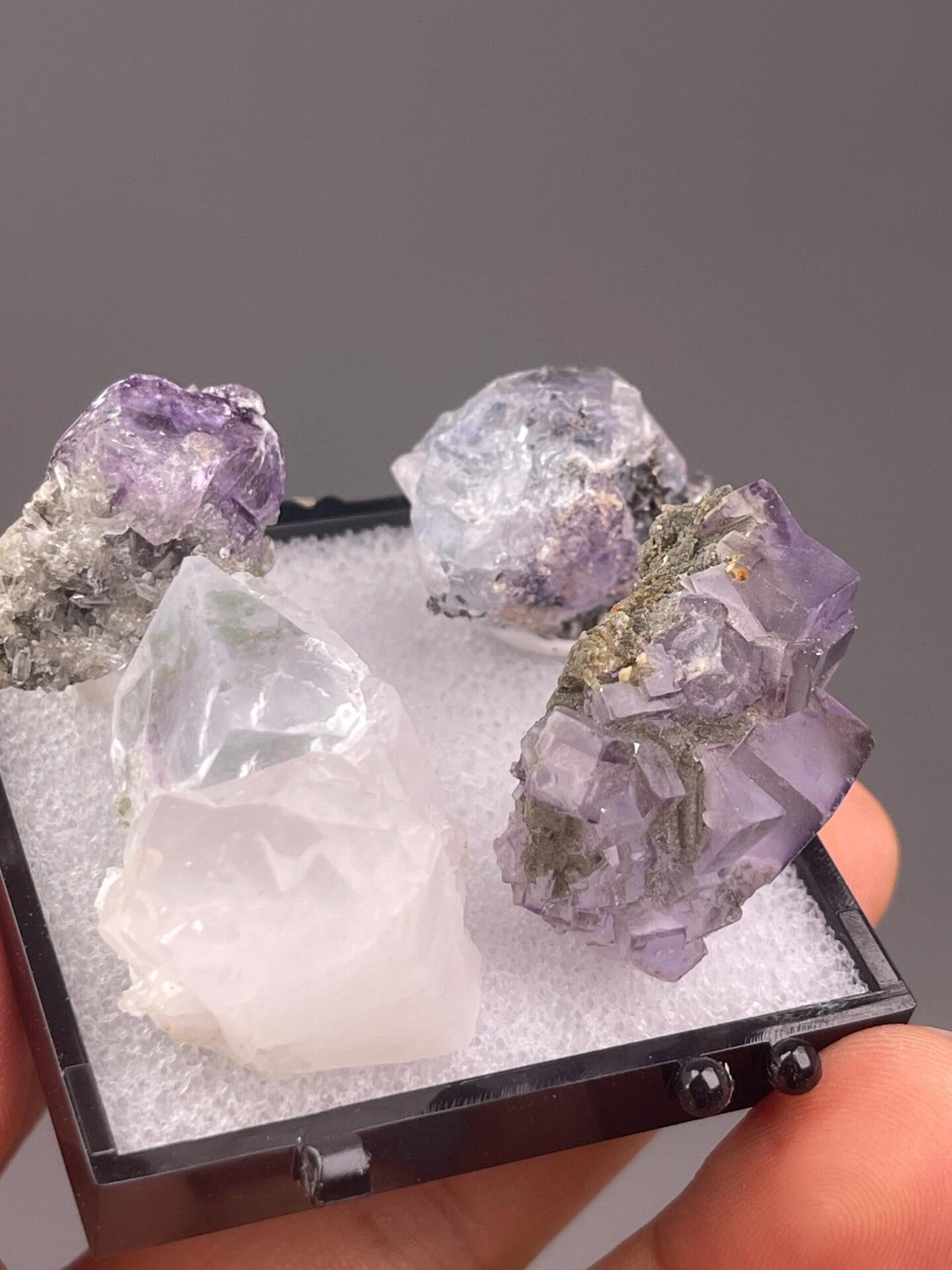Set of four purple fluorite cubic crystals from Yaogangxian