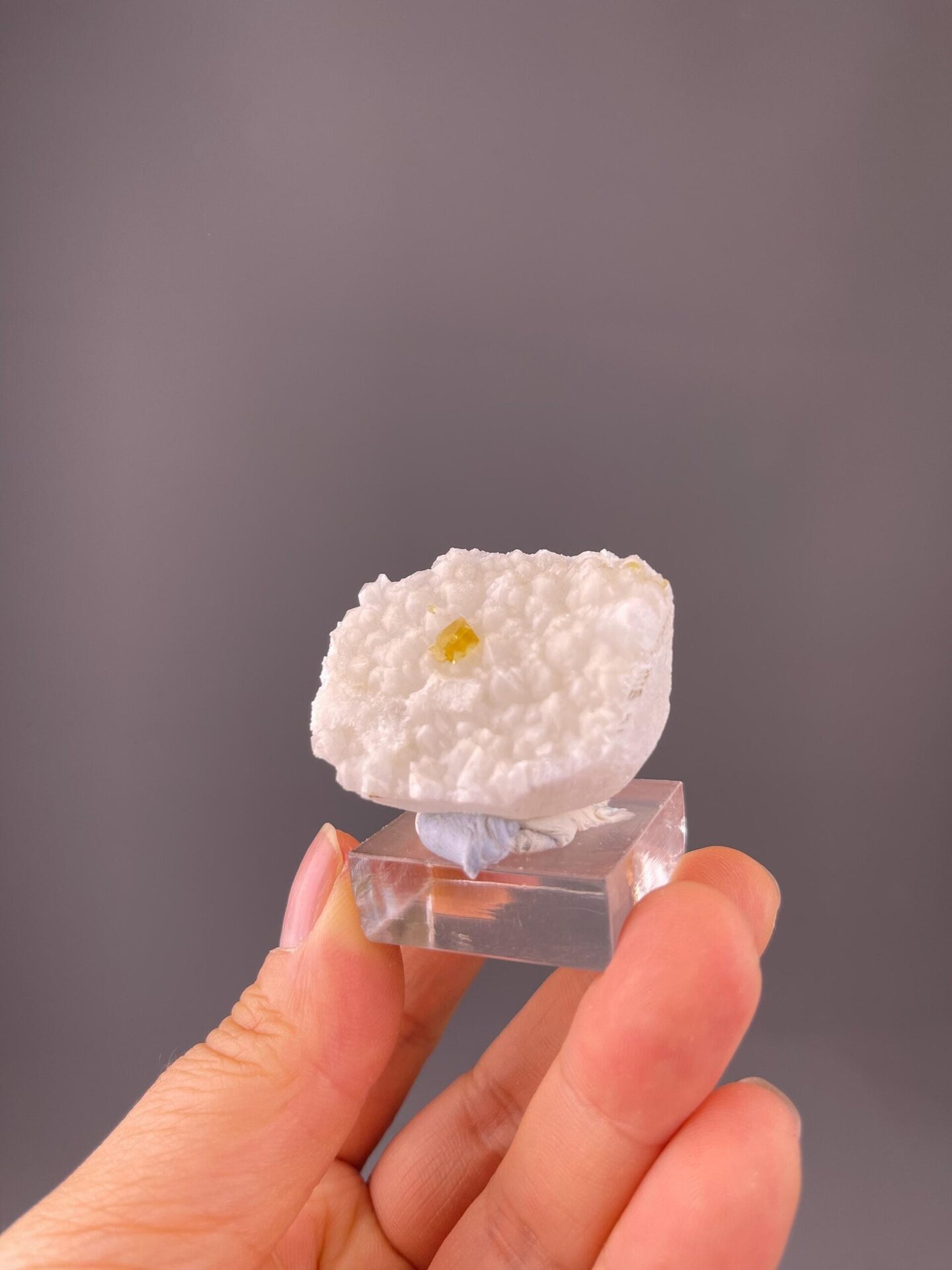 Close-up of yellow barite crystal faces on quartz