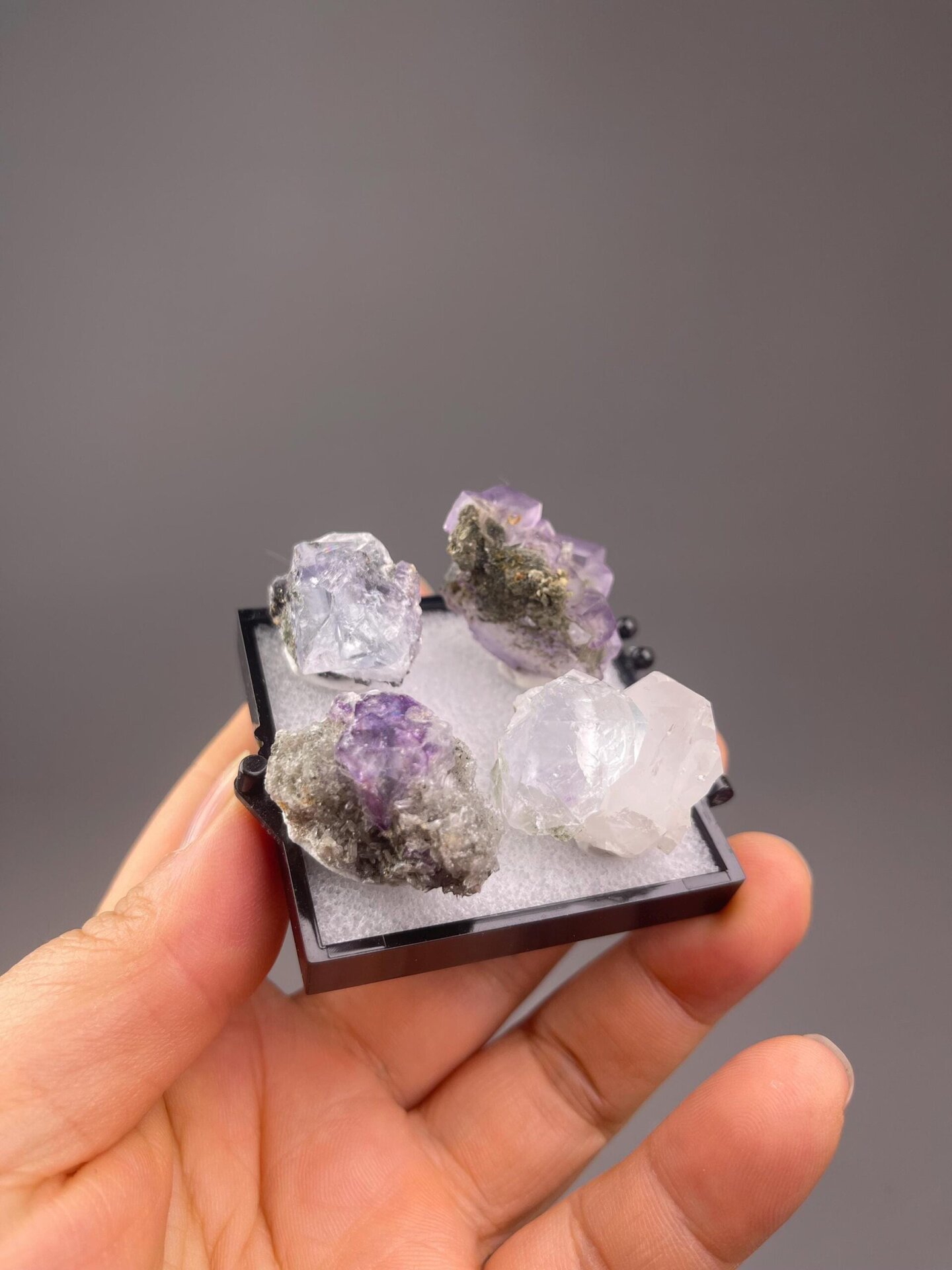 Top view of four purple fluorite crystals together