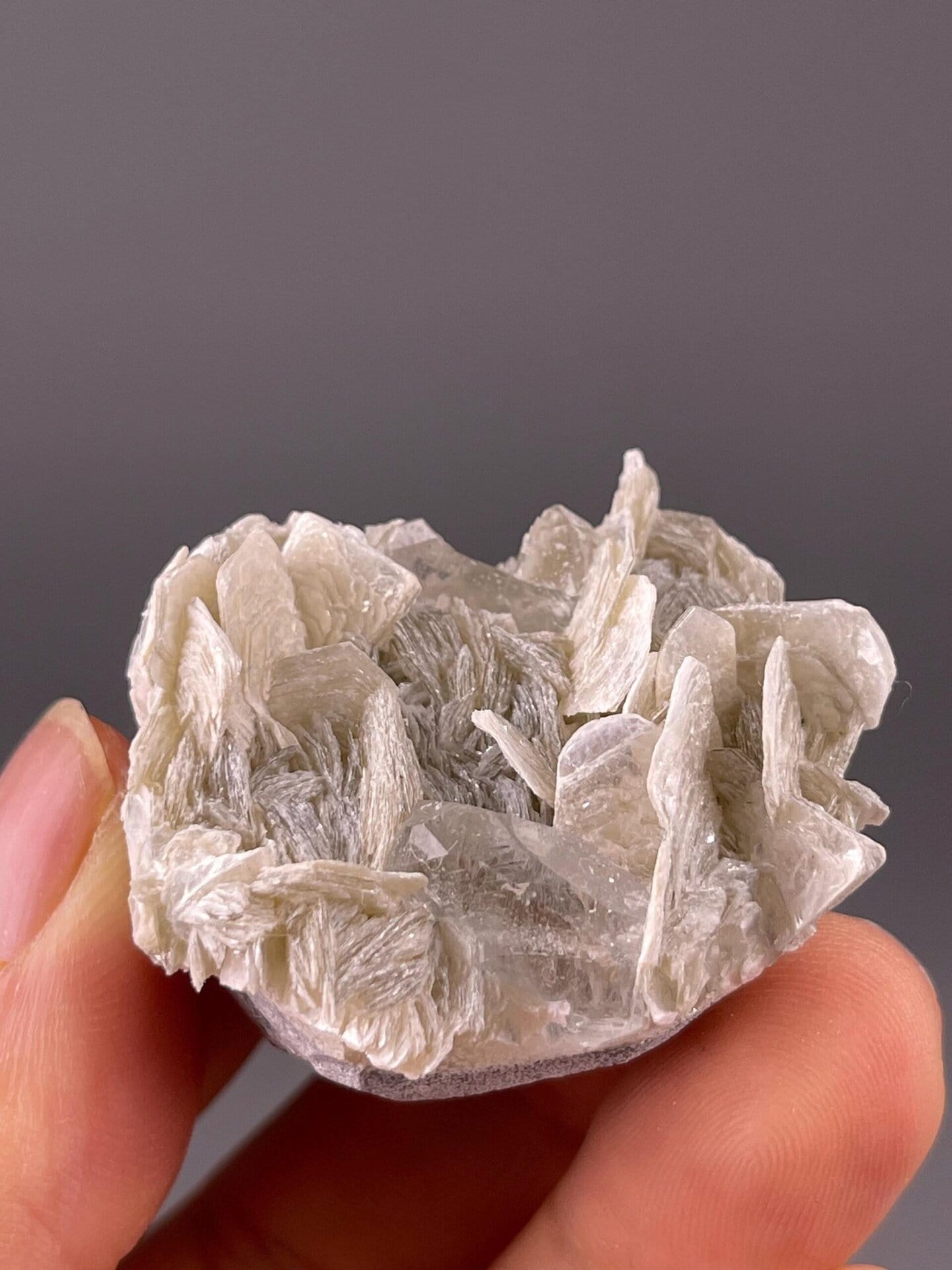 Mica schist matrix beneath aquamarine beryl crystal