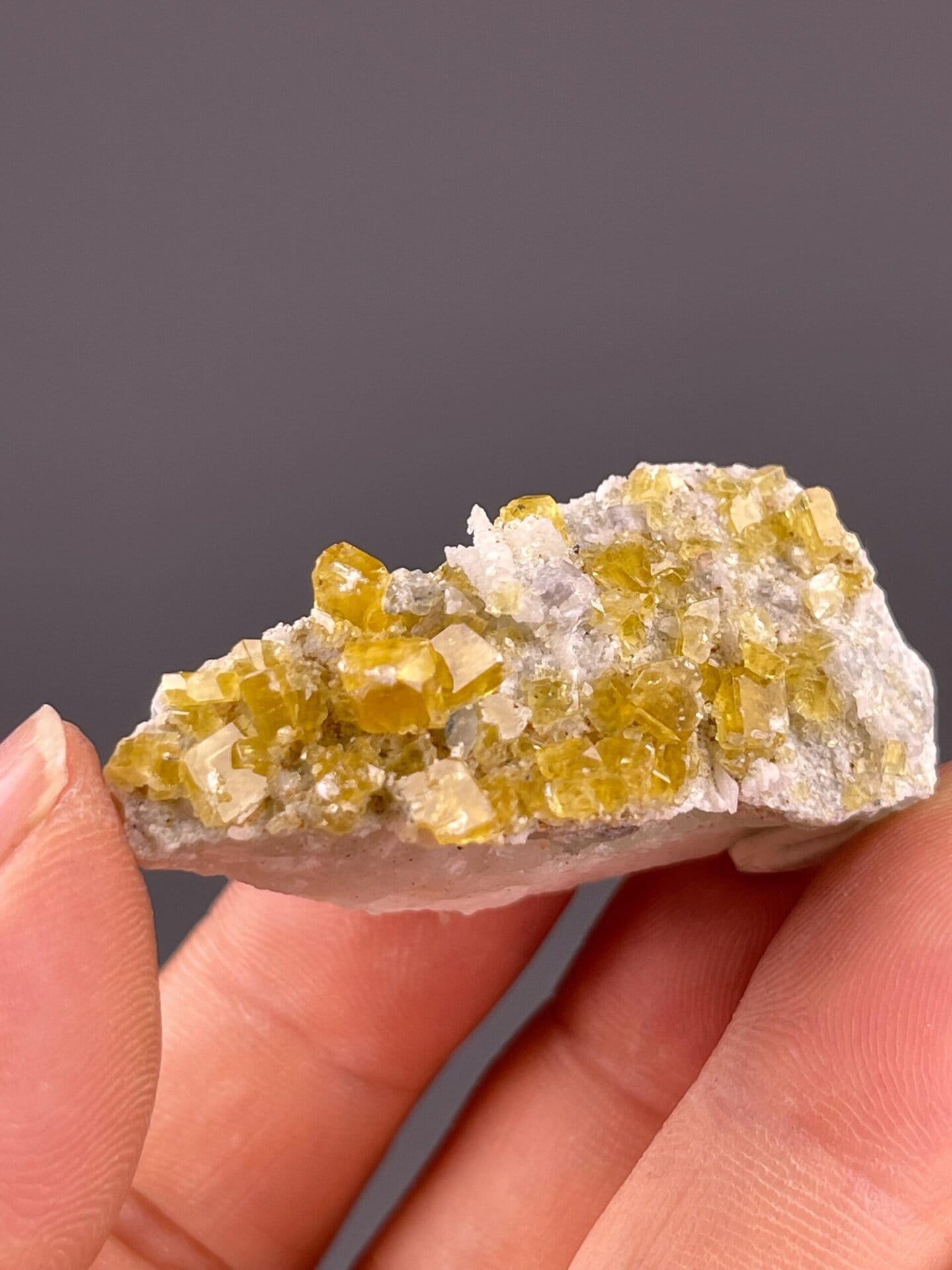 Angled view of yellow fluorite cubic cluster specimen