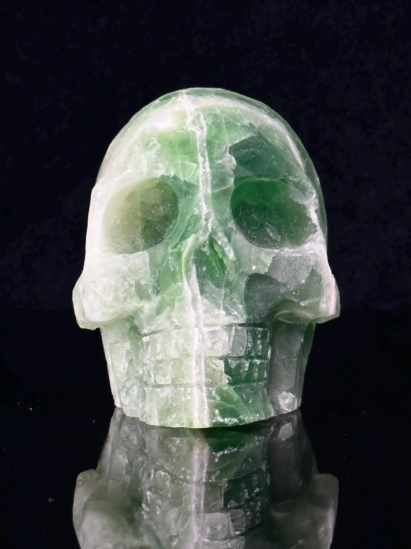 Side profile of fluorite skull carving with geode hollow