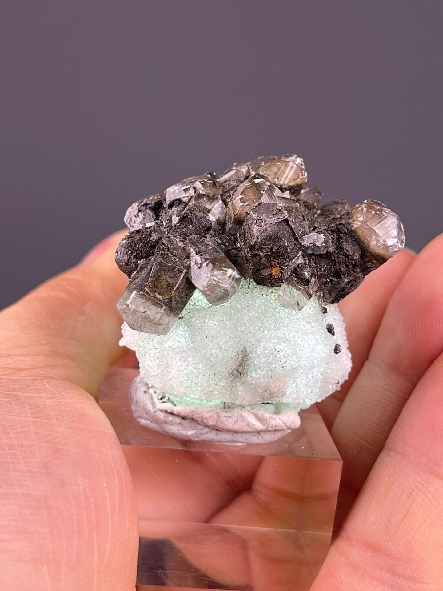 White calcite associated with green fluorite crystals