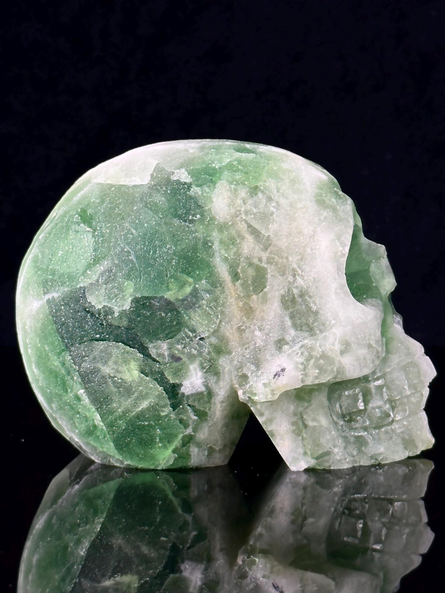 Carved fluorite skull with ruler for scale reference