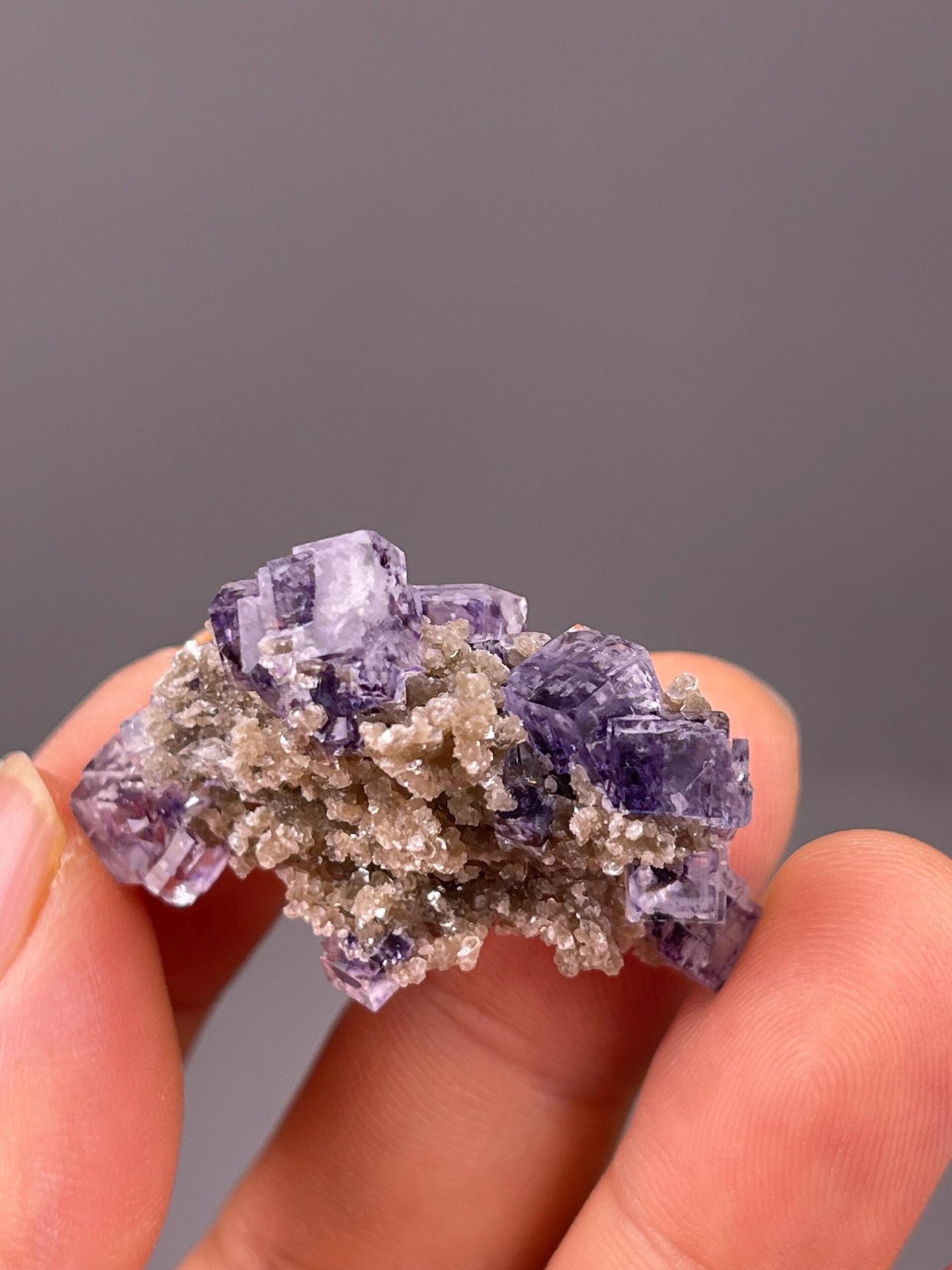 Full two-piece purple fluorite set on white background