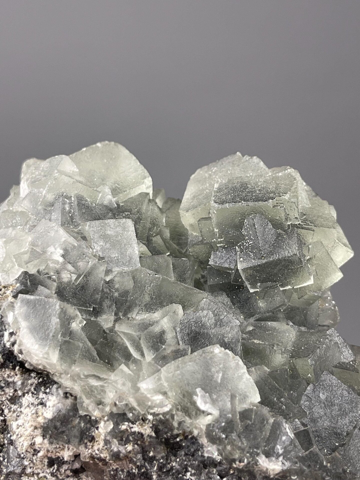 Dense intergrown cubic green fluorite close-up