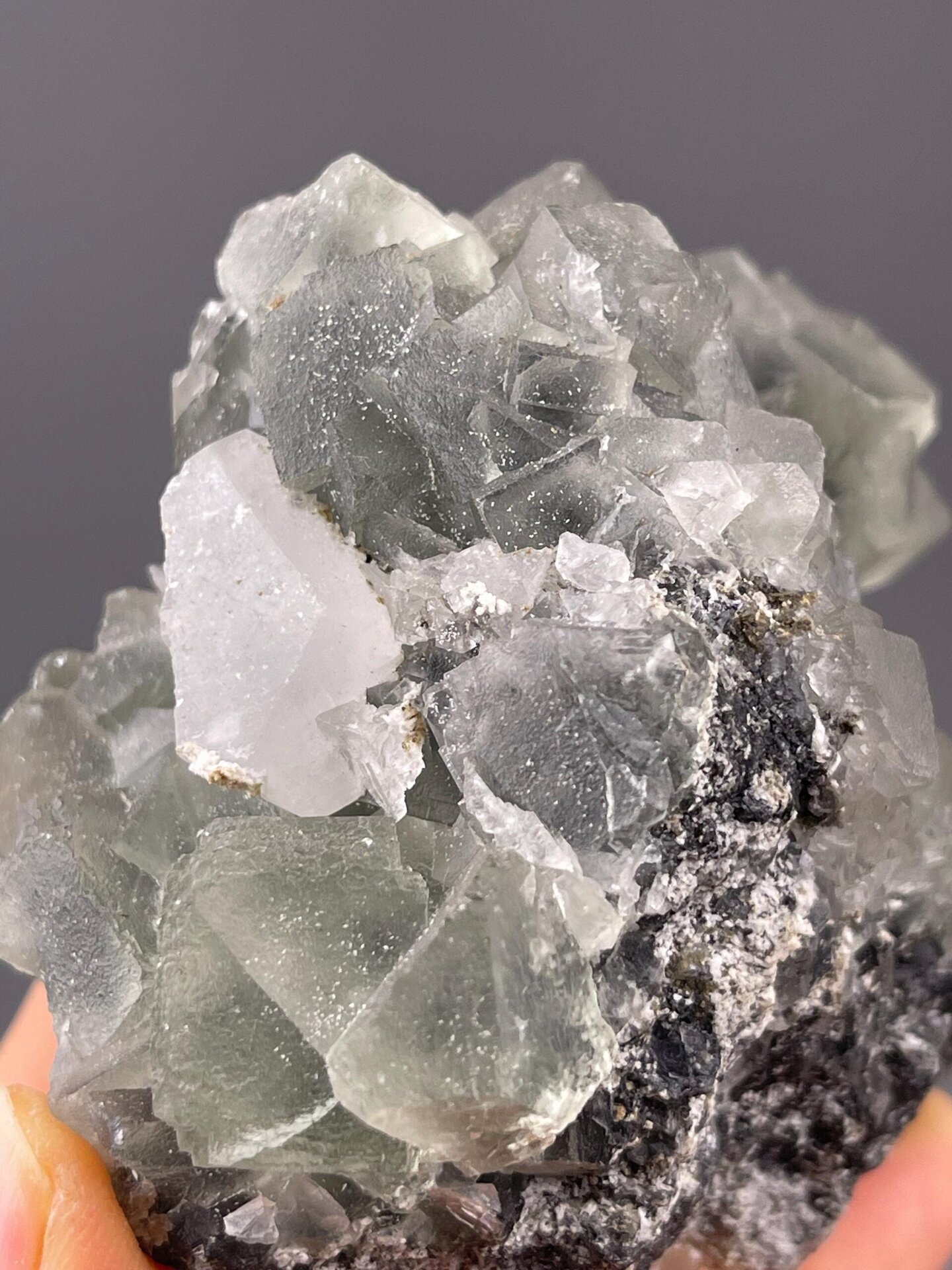 Full large green fluorite cluster on white background