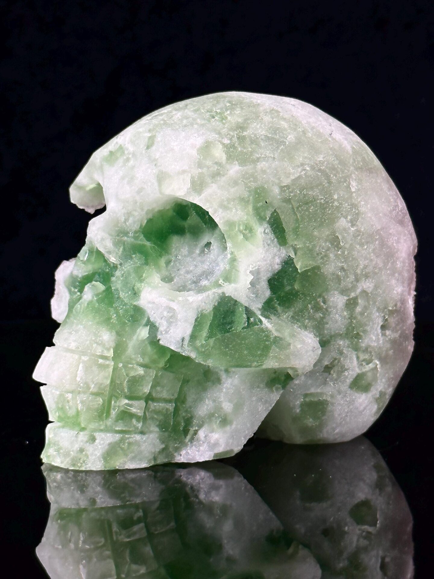 Hand-carved green fluorite skull front view