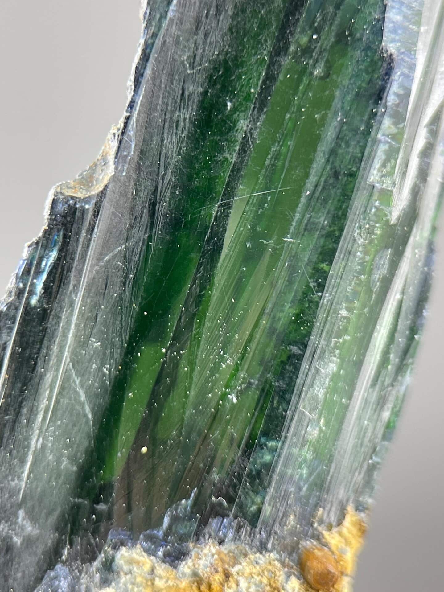 Full green crystal specimen on white background