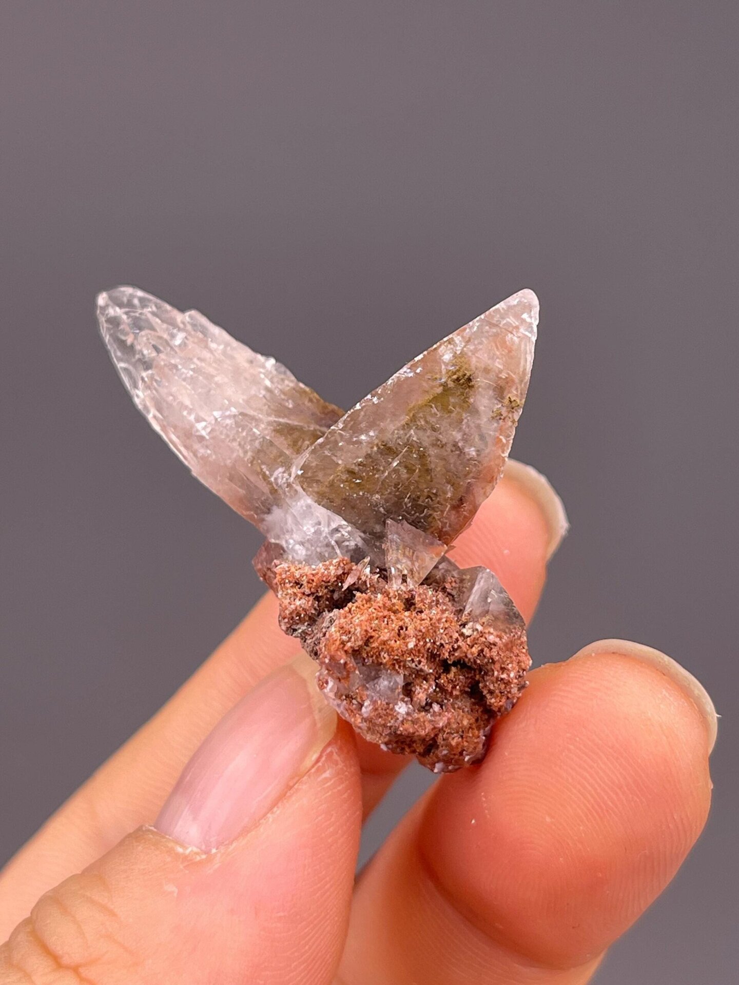 Full twin calcite specimen on white background