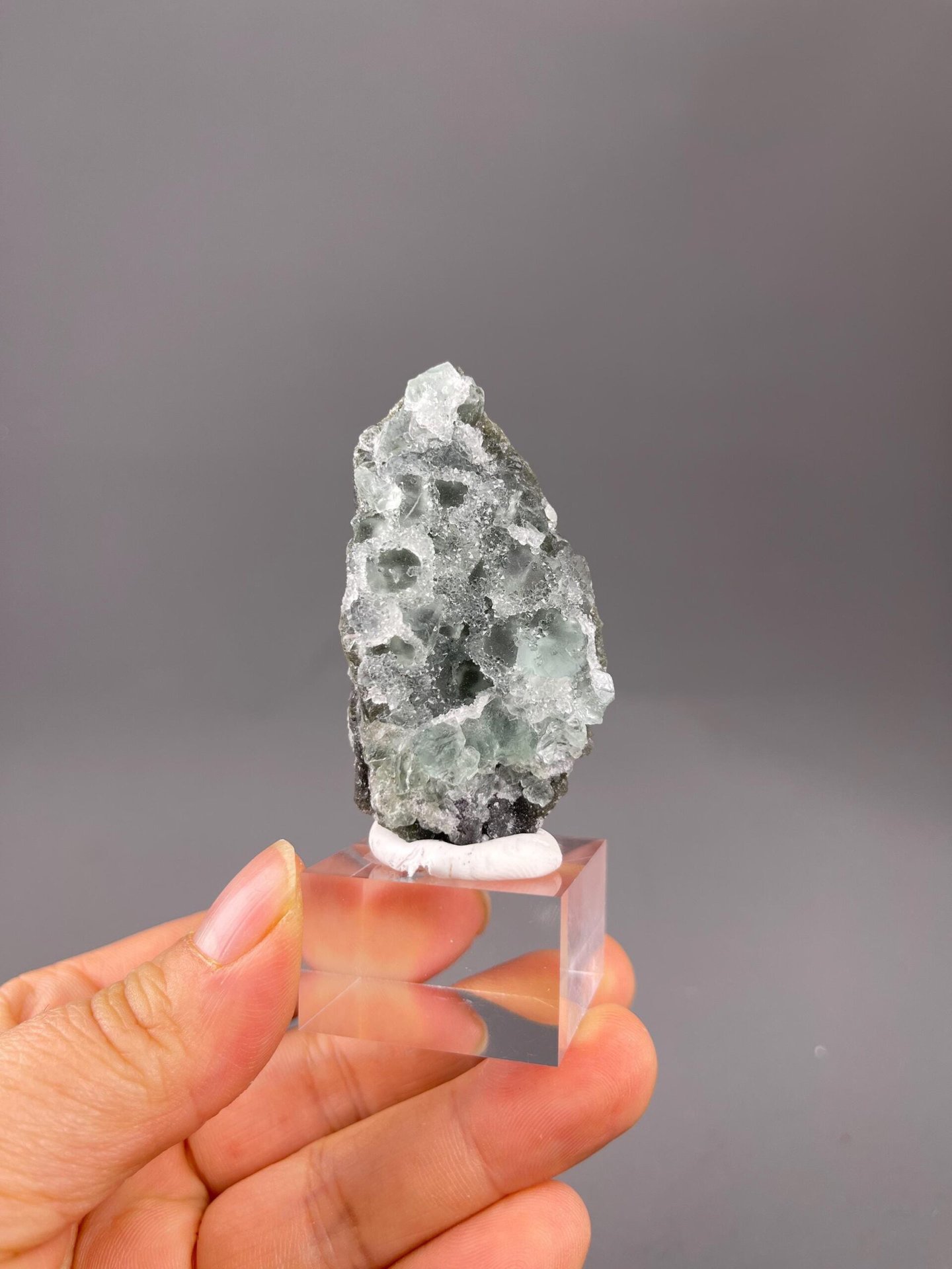 Green fluorite core beneath quartz crystal layer