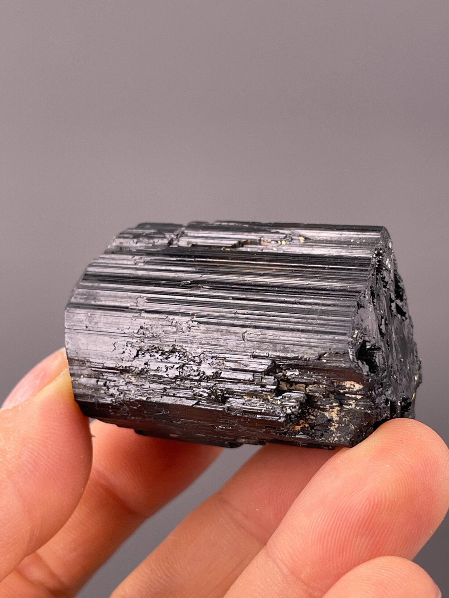 Natural raw crystal surface of schorl tourmaline