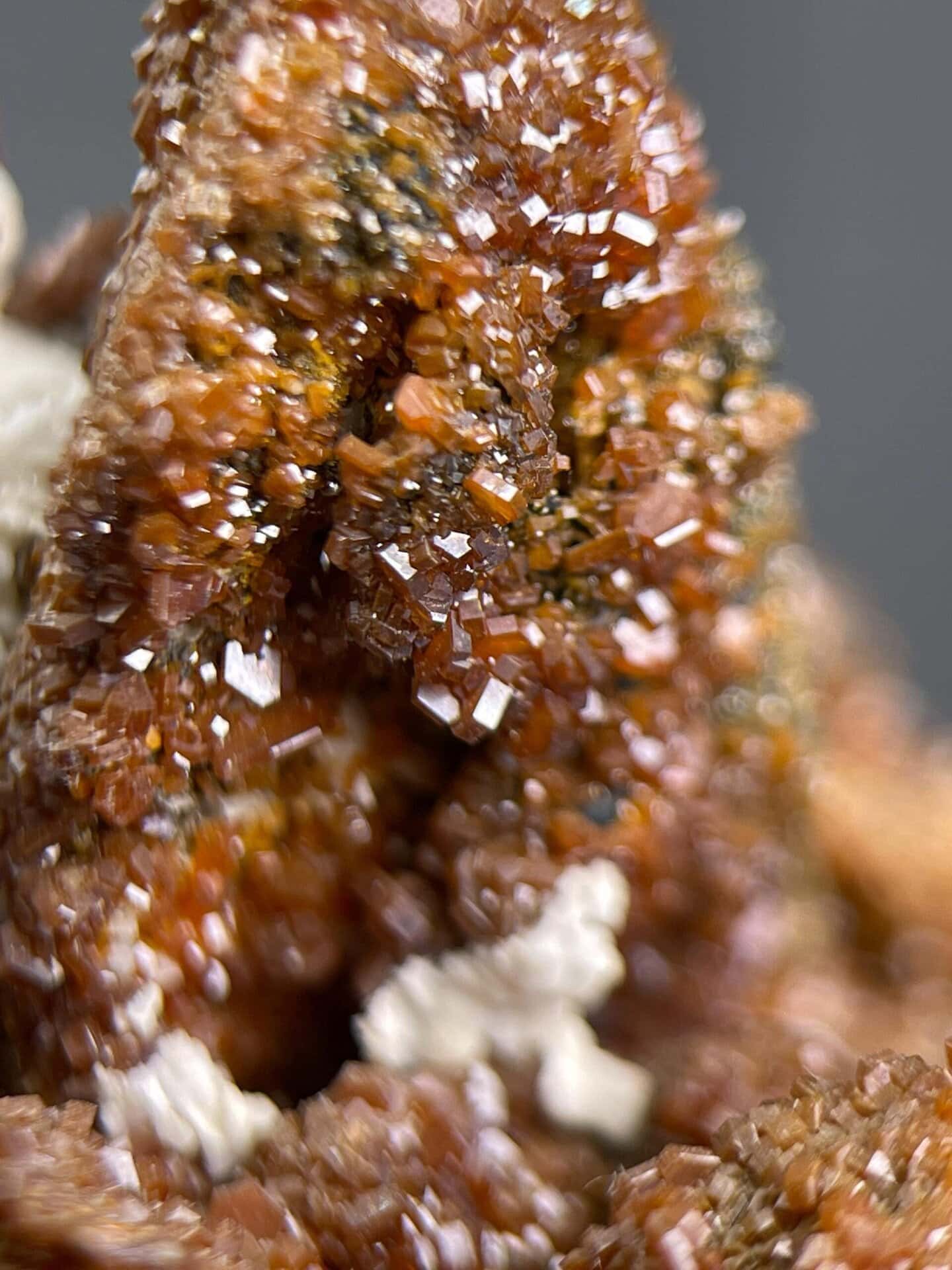 Adamantine luster on deep red vanadinite crystals