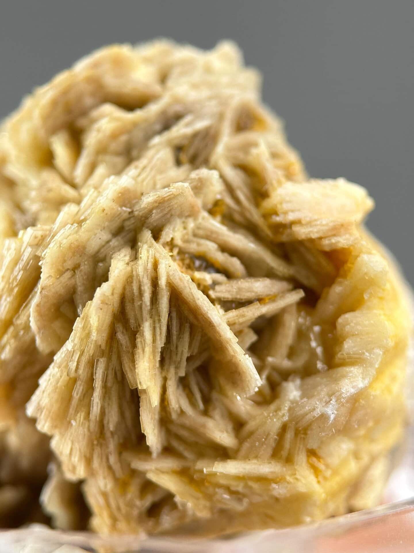 Crystal faces of golden barite showing vitreous luster