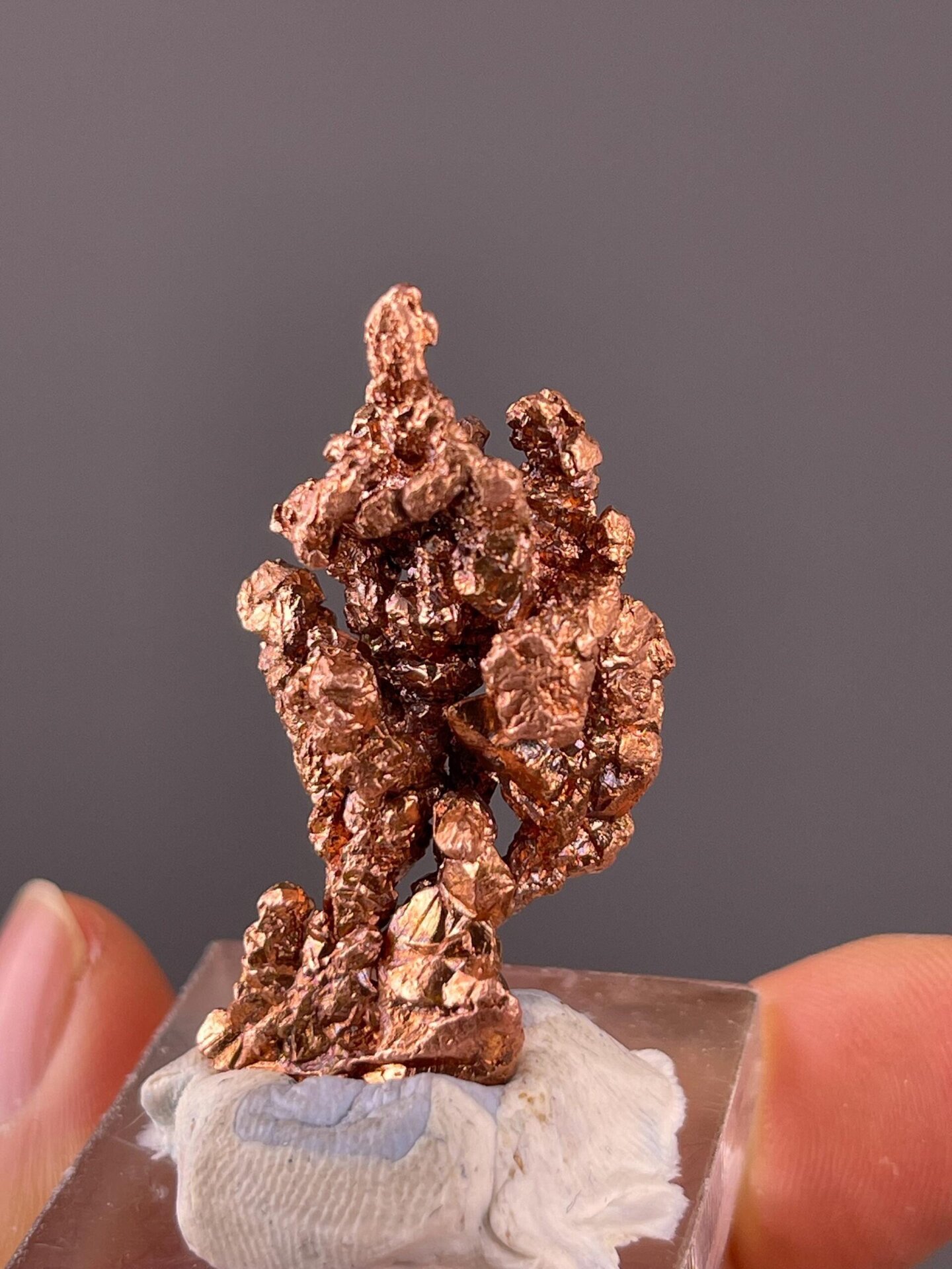 Metallic reddish luster on native copper surface