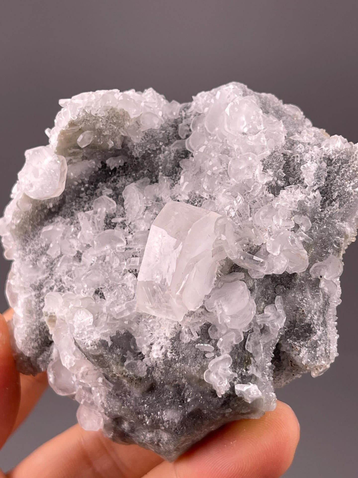 Pink calcite glowing under UV ultraviolet light