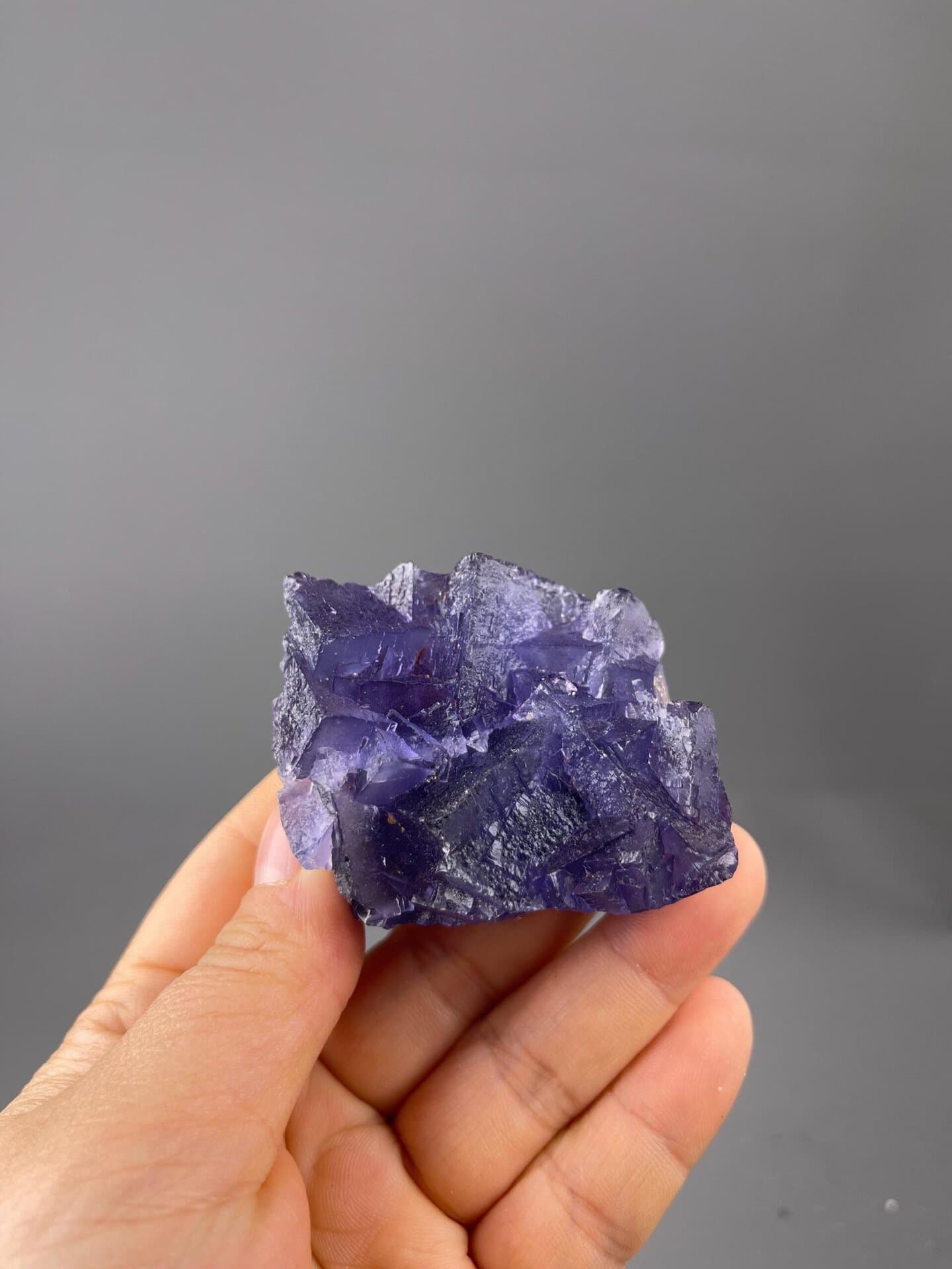 Vitreous luster on deep purple fluorite faces