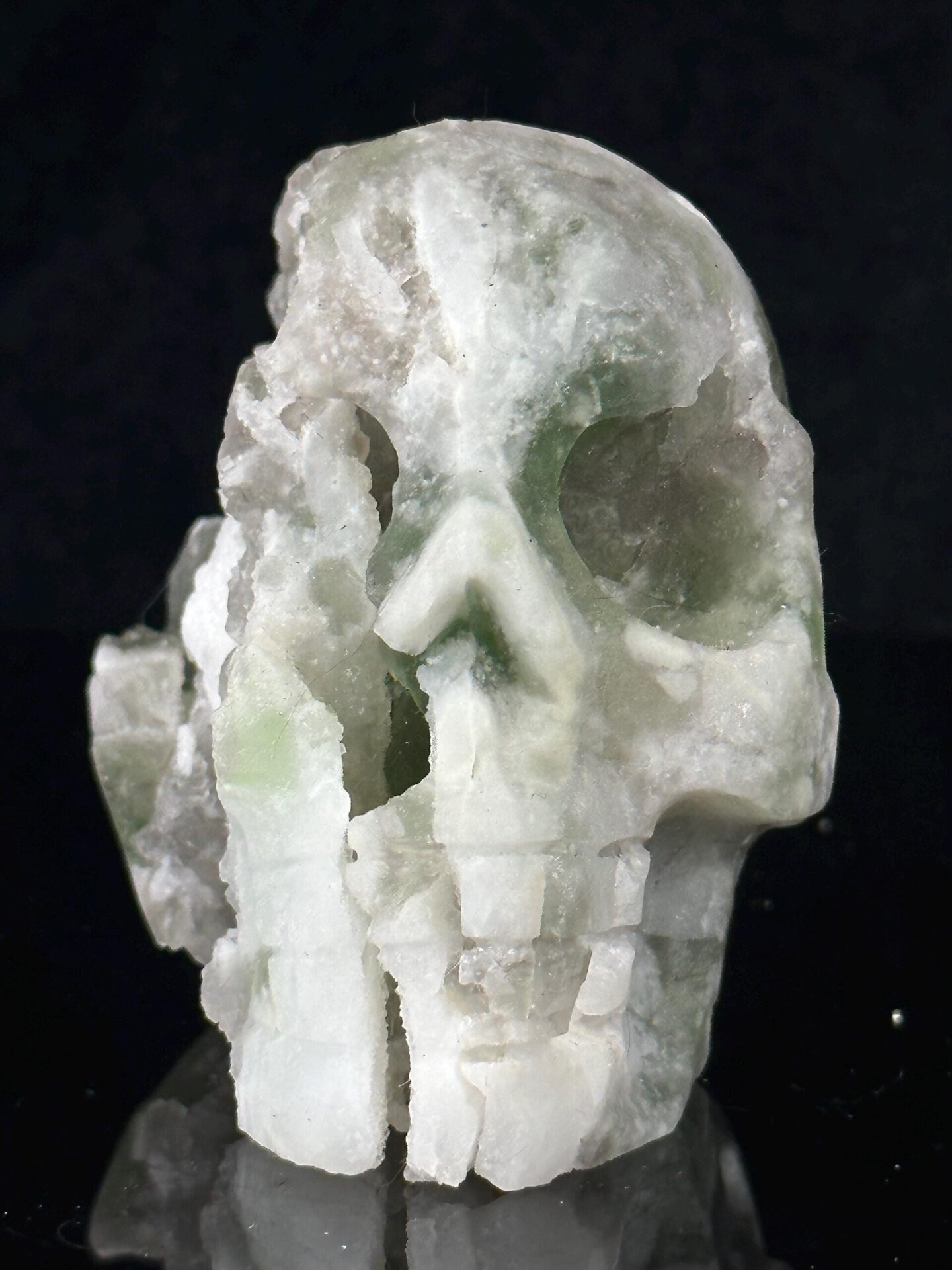 Front view of hand-carved green fluorite skull