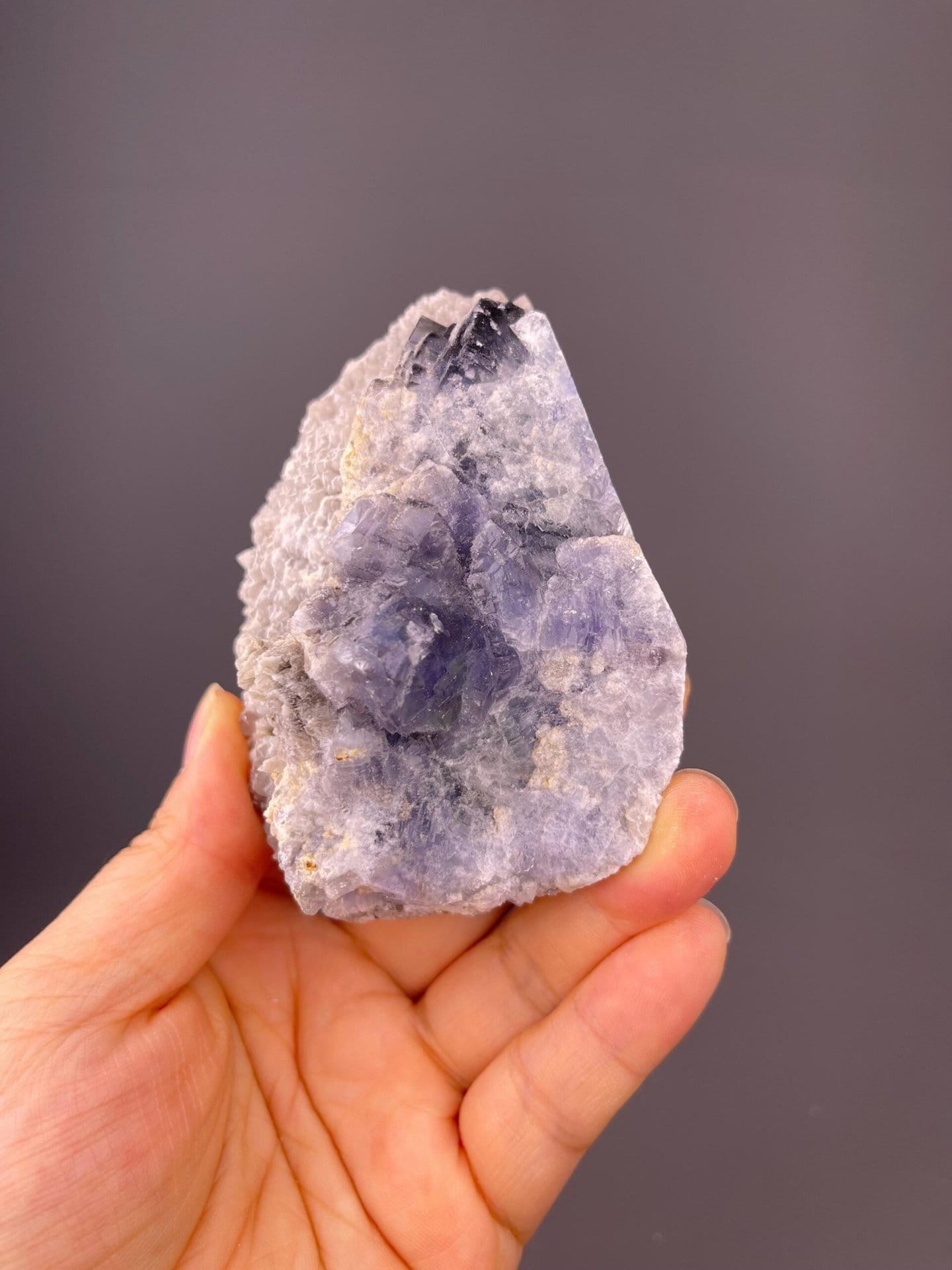 Close-up of naturally etched blue fluorite crystal faces