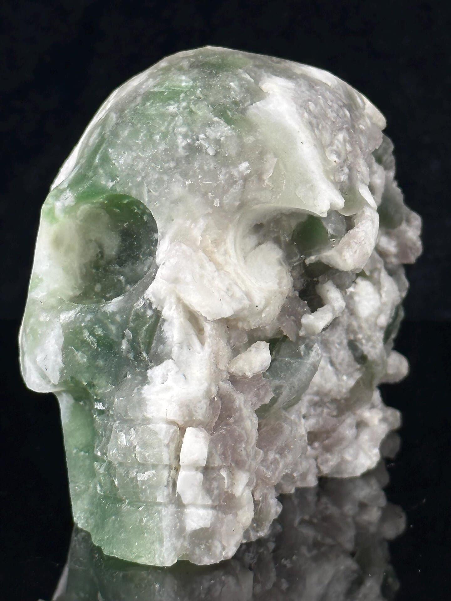 Natural geode formation embedded in fluorite skull