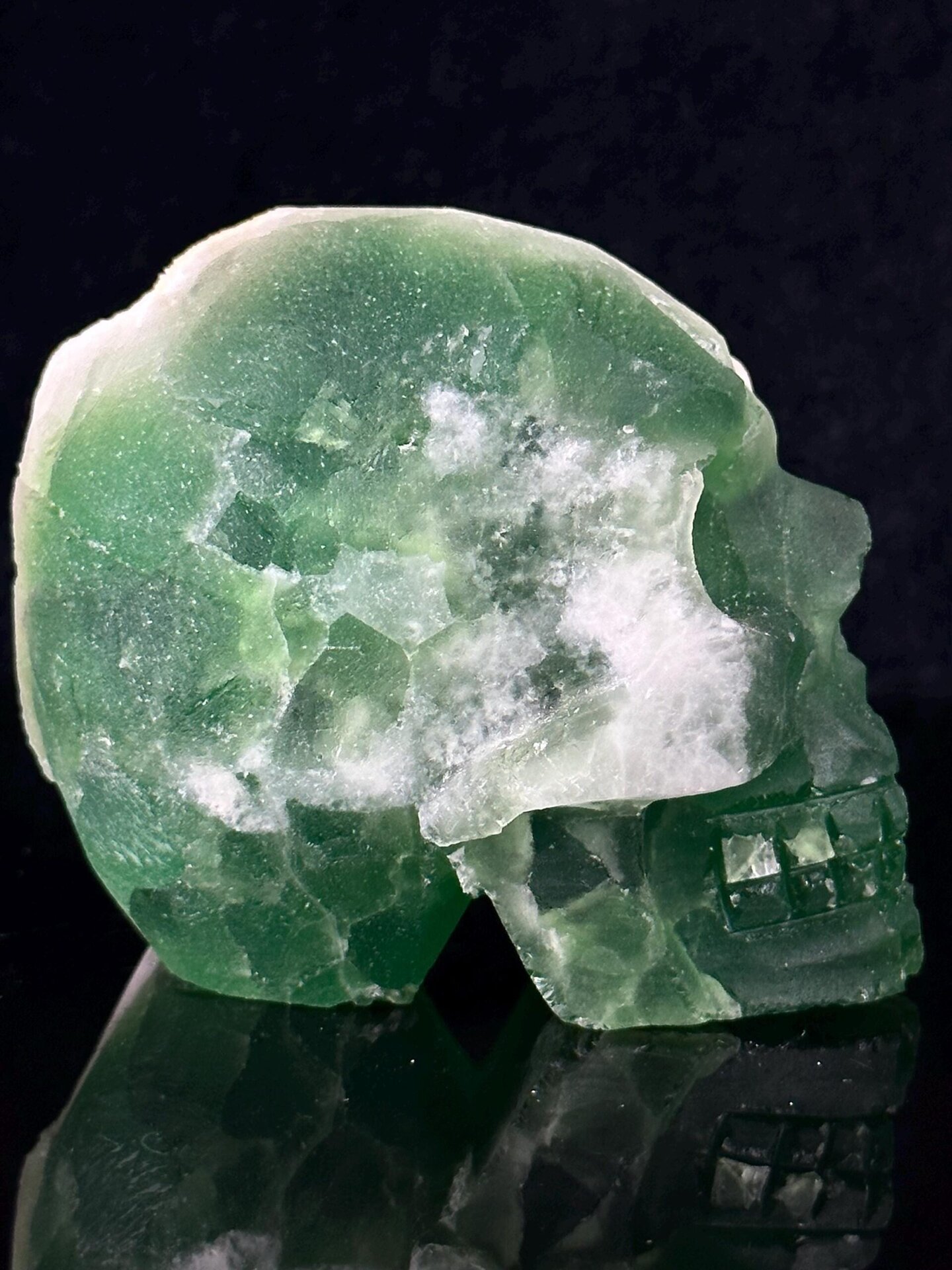 Close-up of deep green fluorite color in carved skull