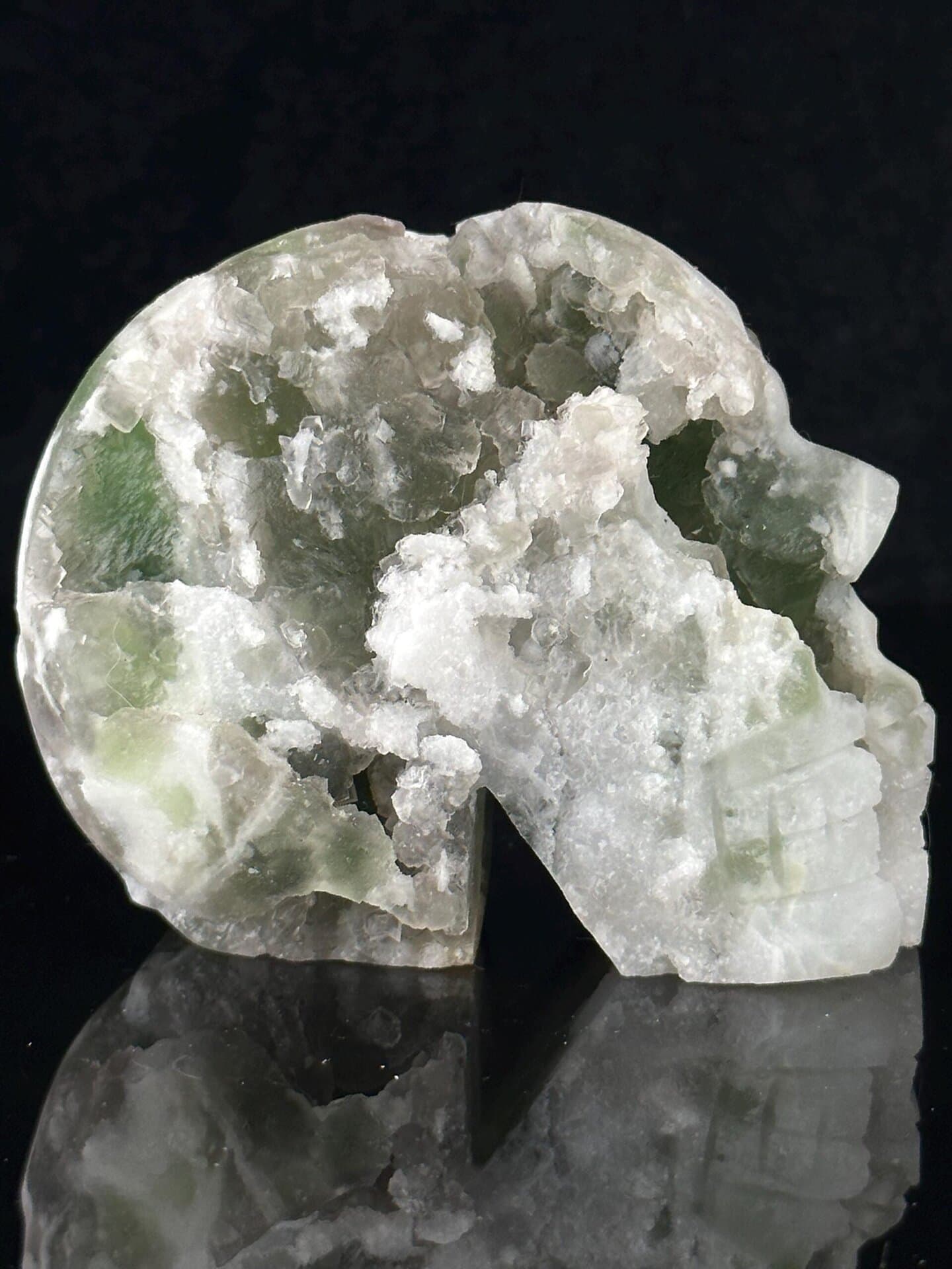 Raw fluorite mineral texture on skull carving