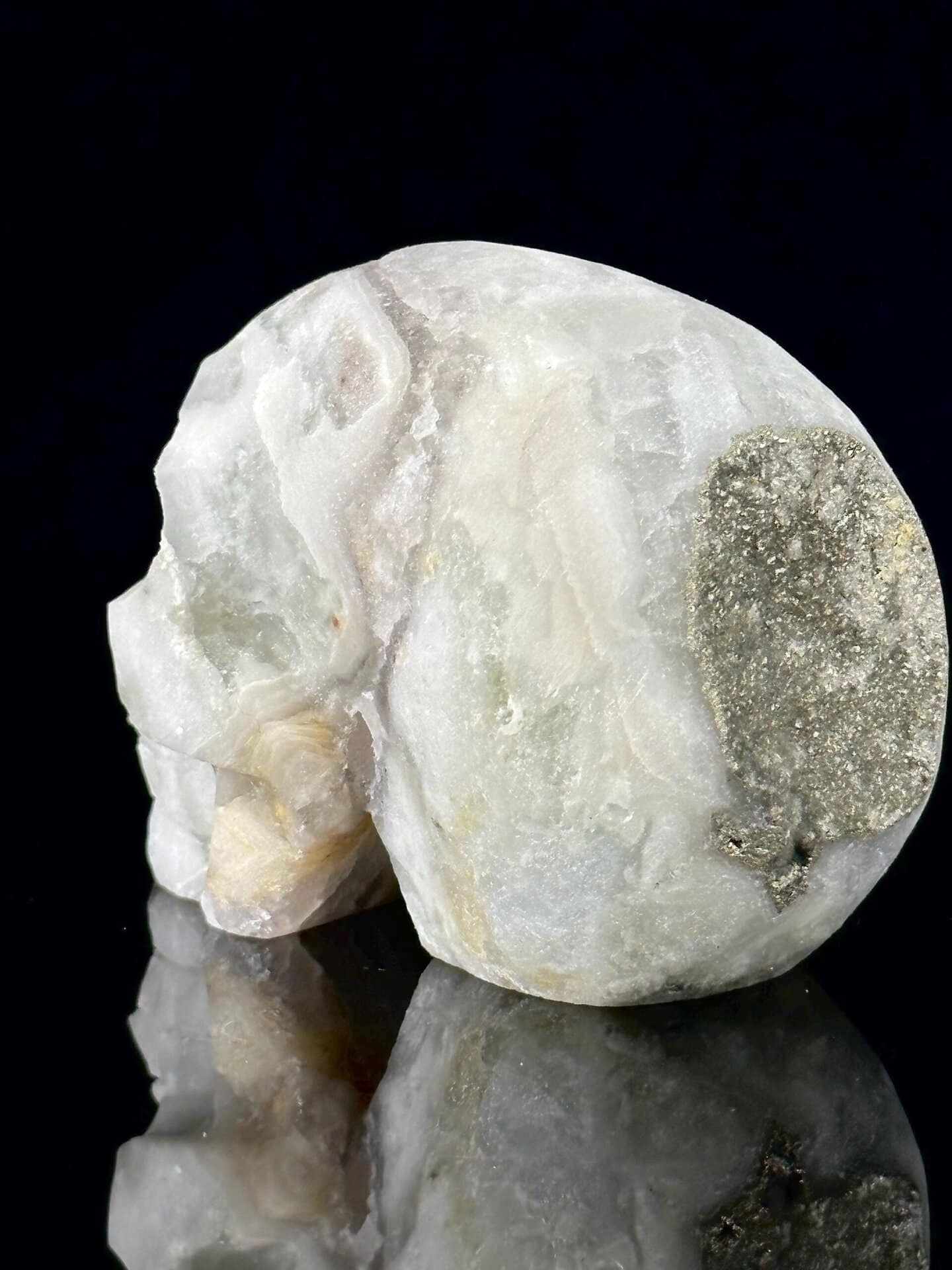 Fluorite skull with pyrite under studio lighting