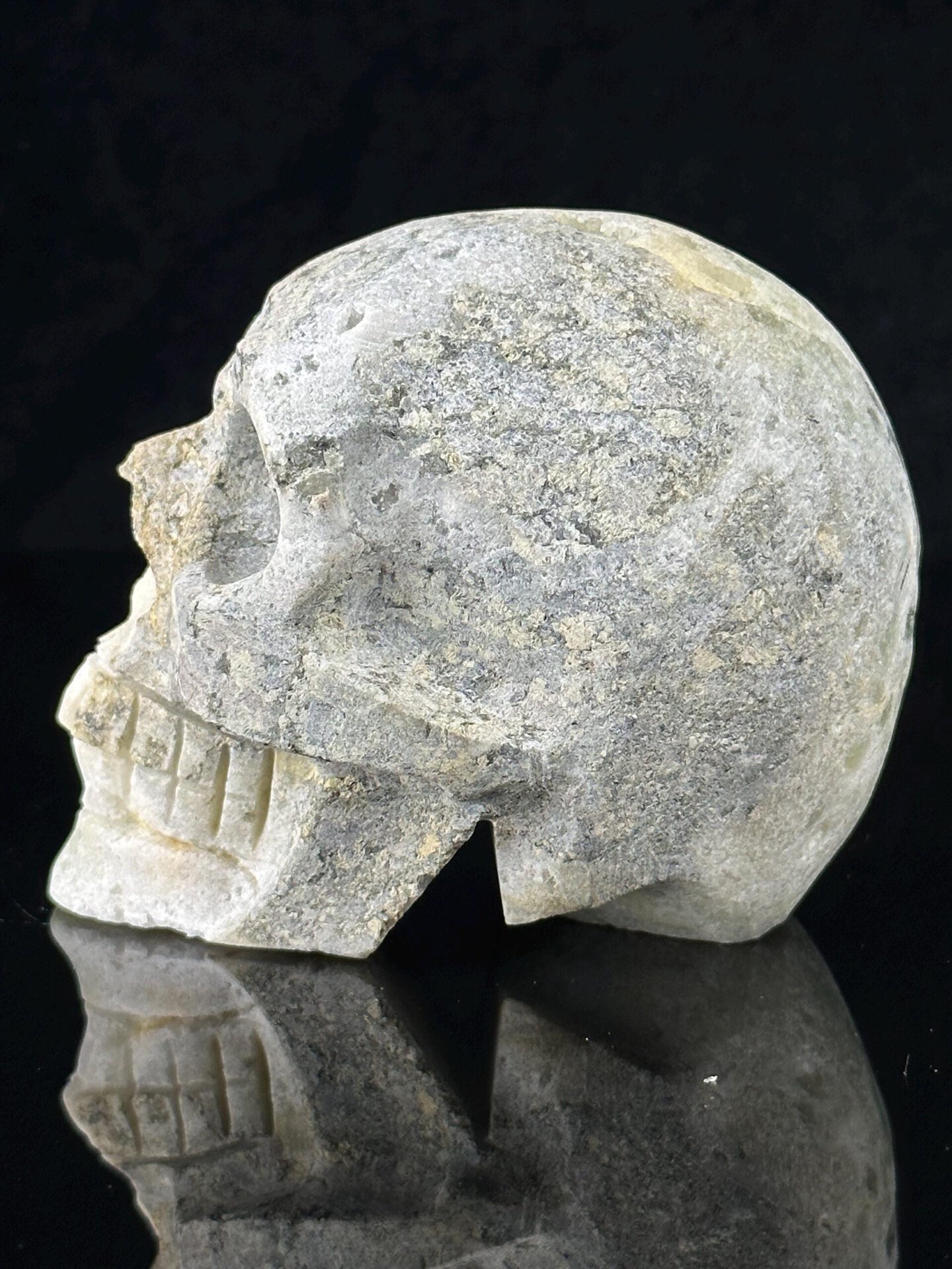 Back view of fluorite skull showing raw mineral matrix