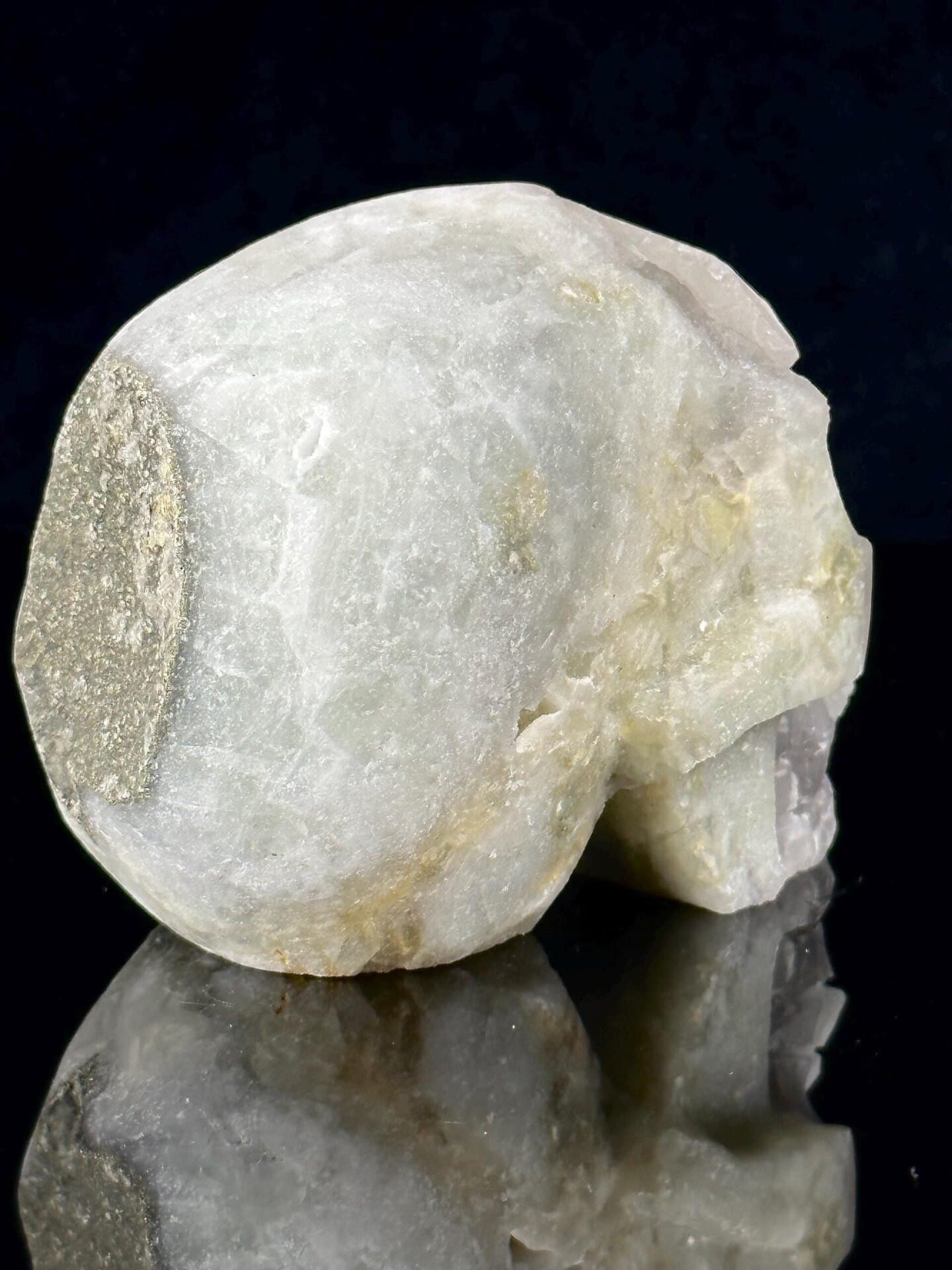 Pyrite inclusion detail on polished fluorite skull surface
