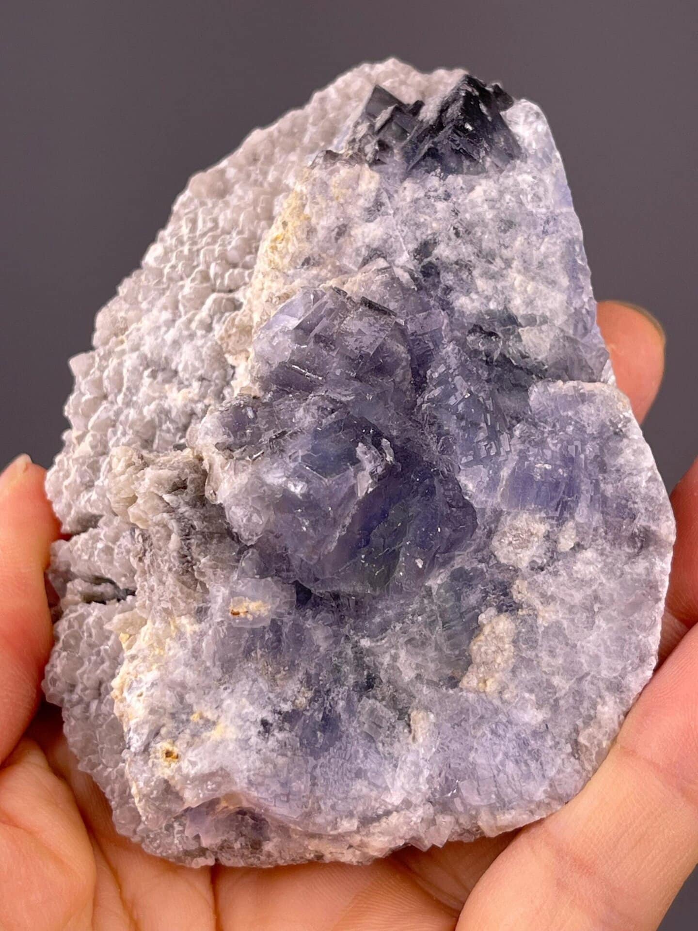 Vitreous luster on tanzanite-blue fluorite faces