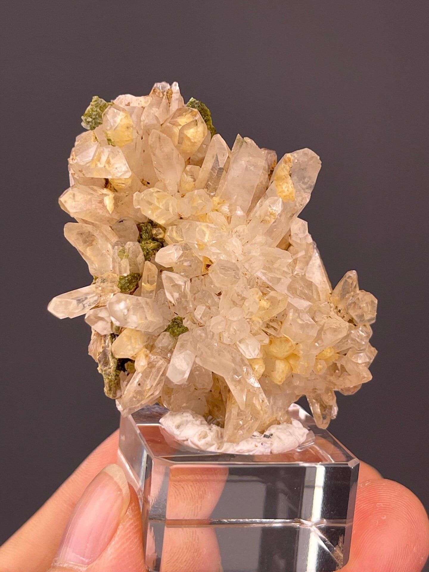 Front view of garden quartz cluster with epidote inclusions