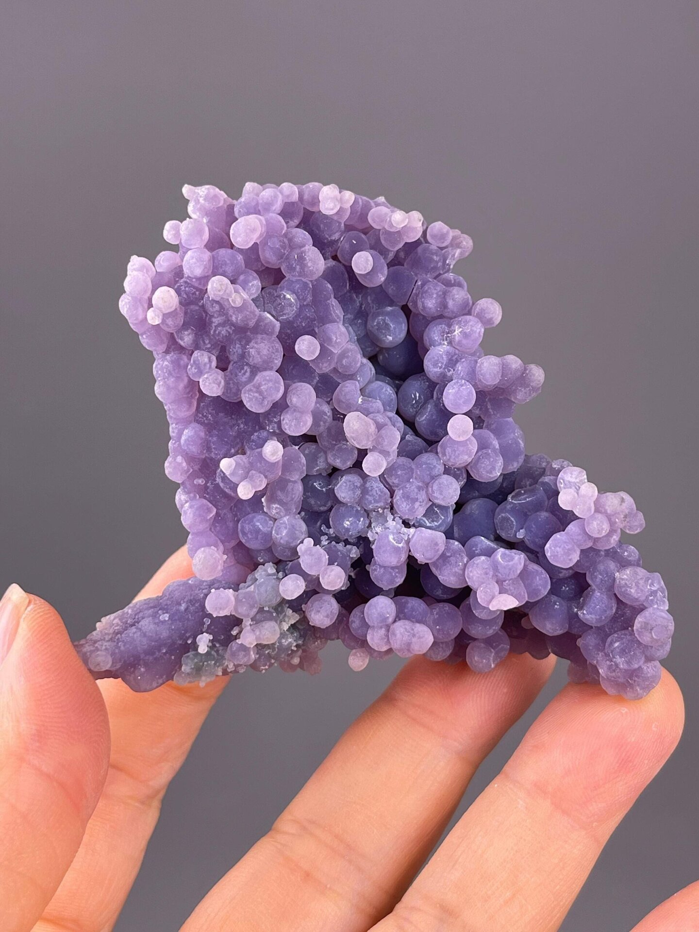 Front view of purple botryoidal grape agate from Indonesia