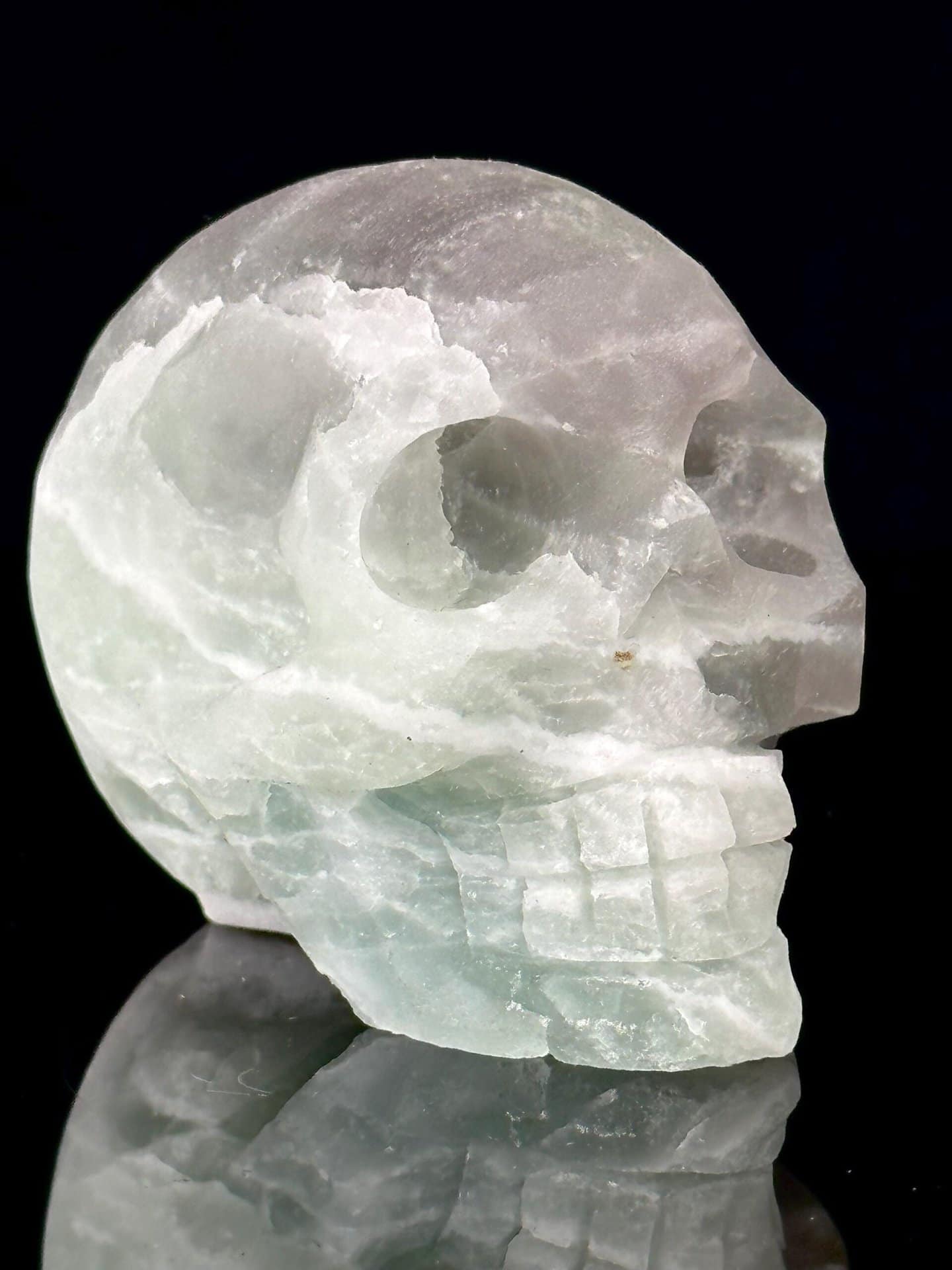 Front view of hand-carved green fluorite skull from Brazil