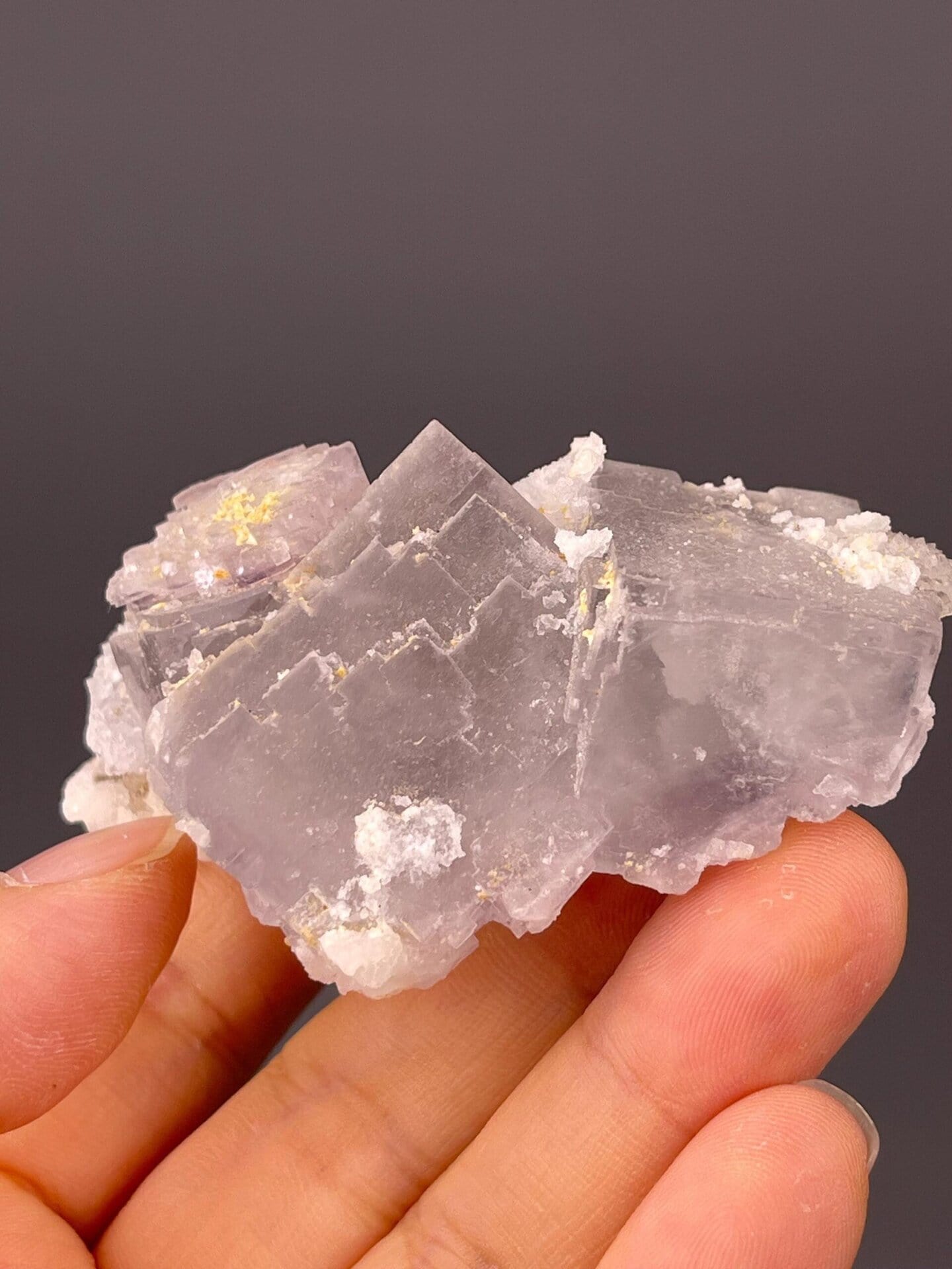 Close-up of quartz crystals enveloping fluorite