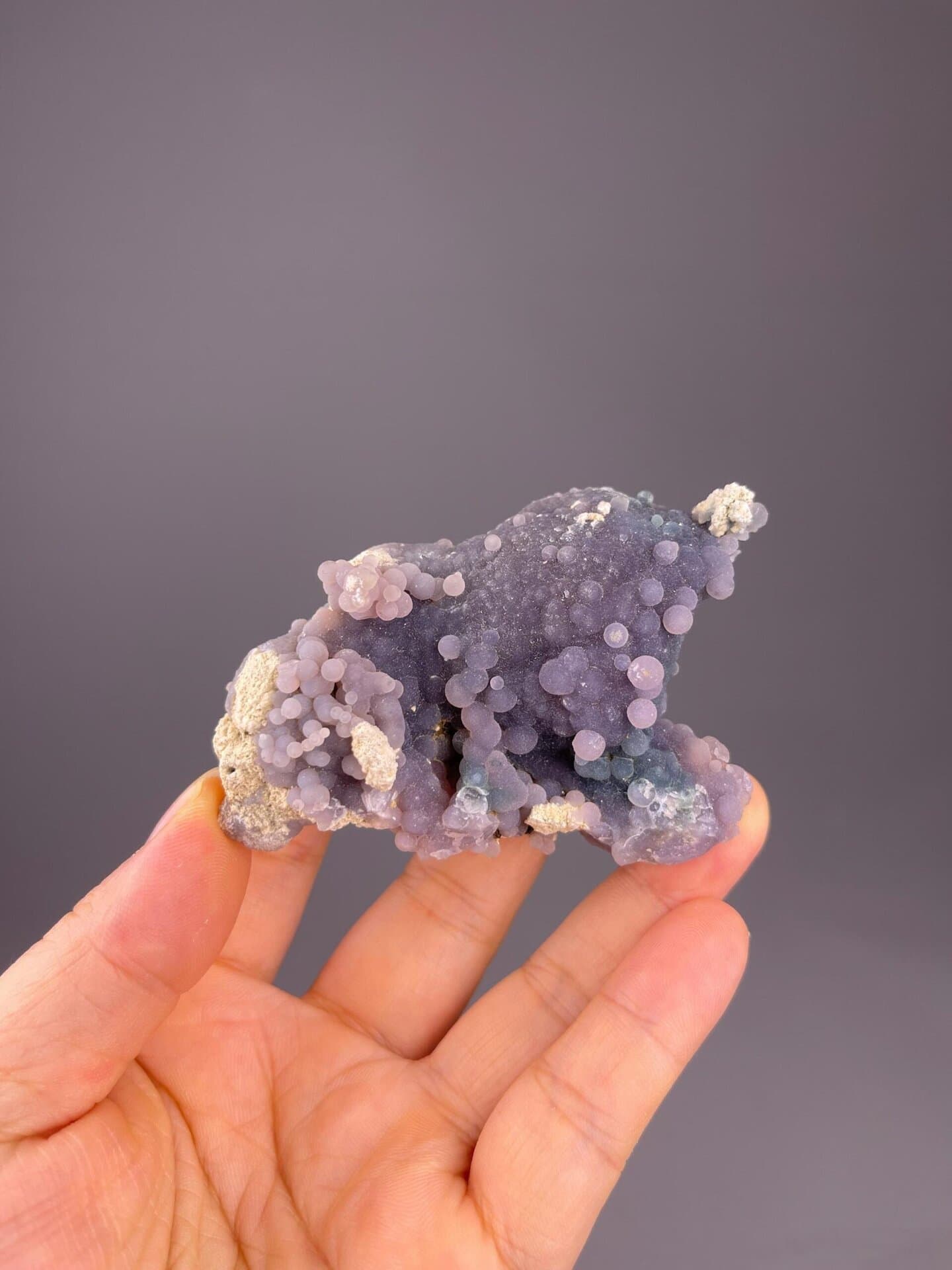 Close-up of round lavender grape agate formations