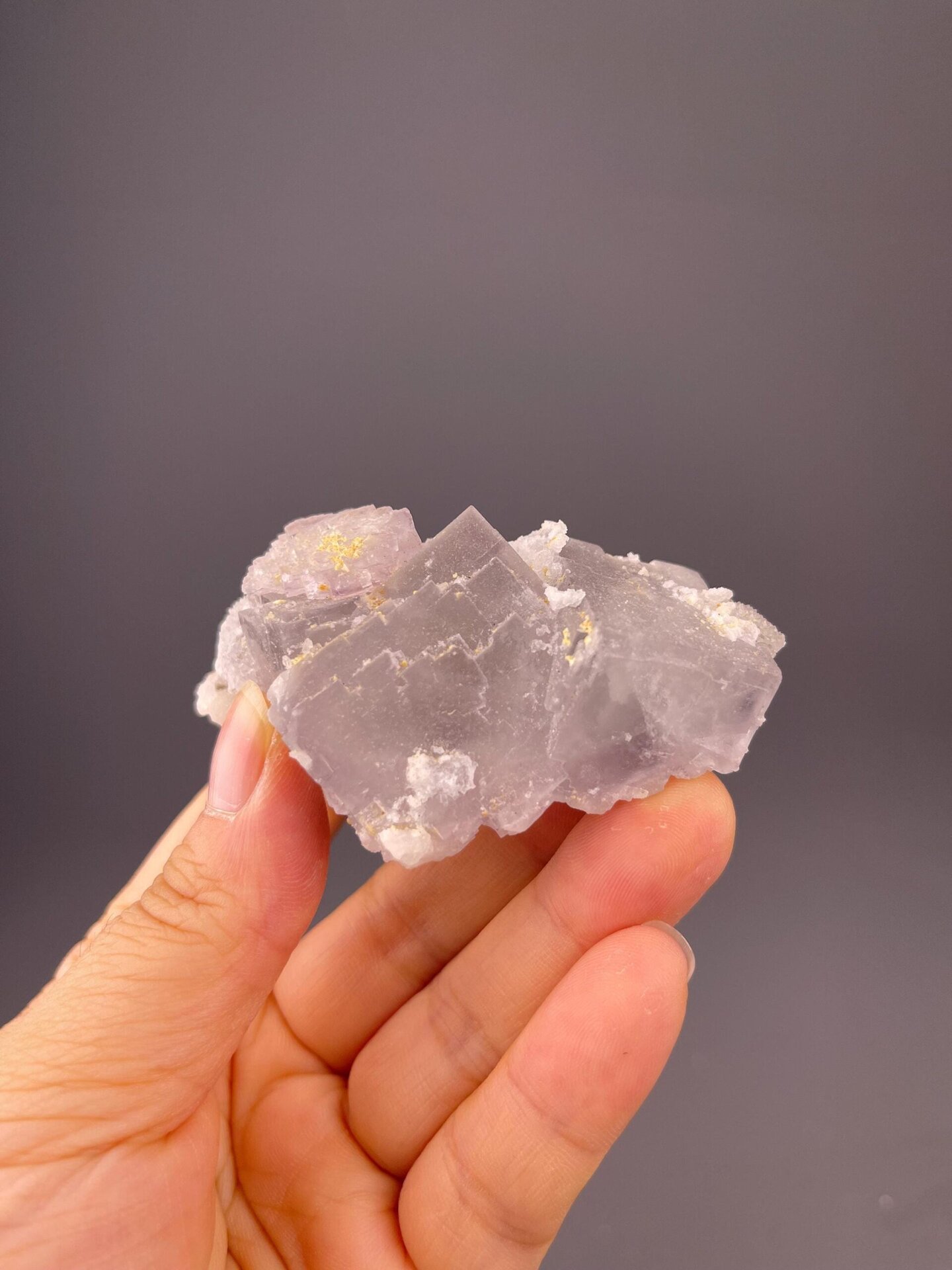 Sparkling clear quartz points over pale green fluorite