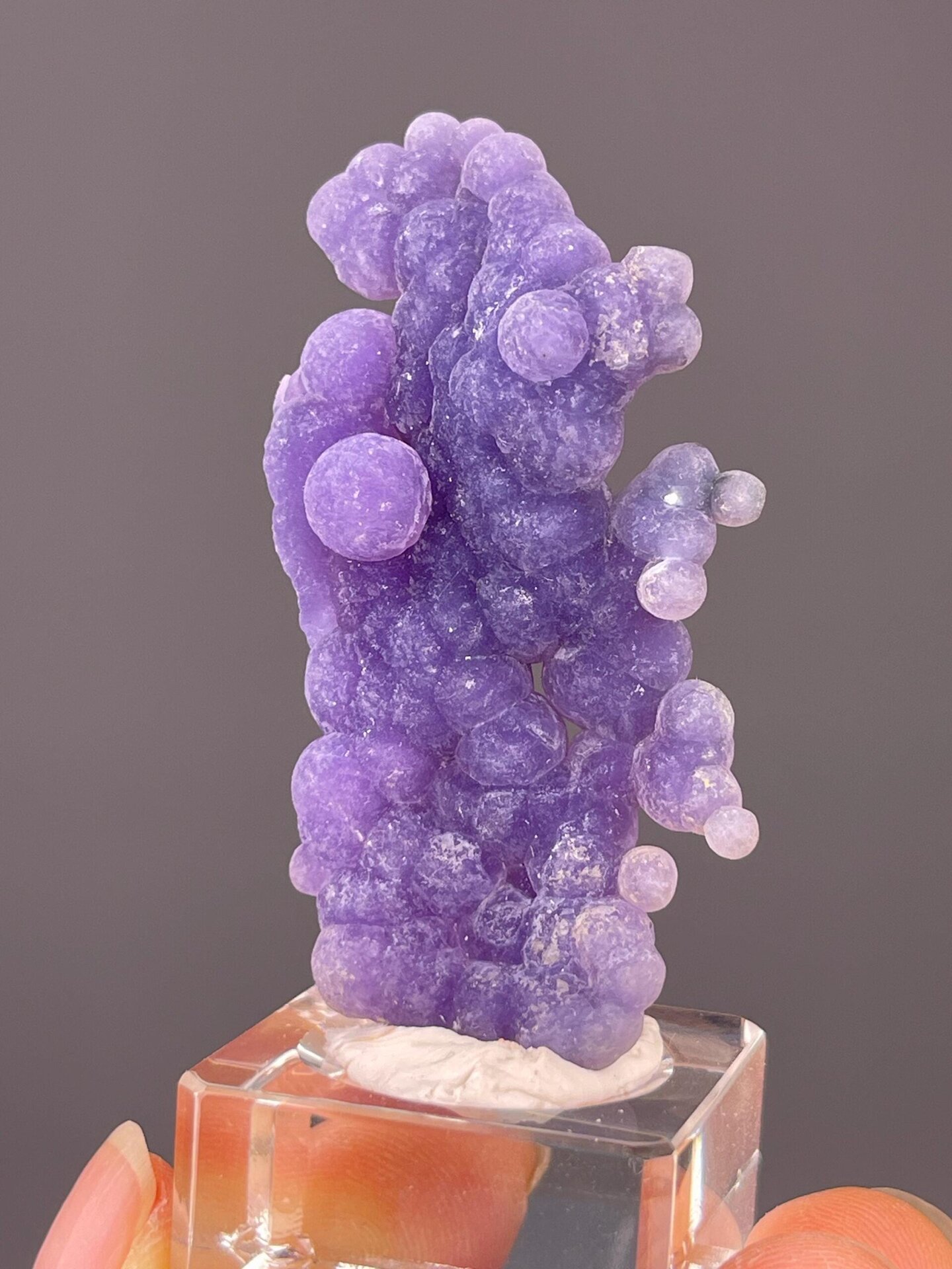 Top view of rounded purple grape agate spheres