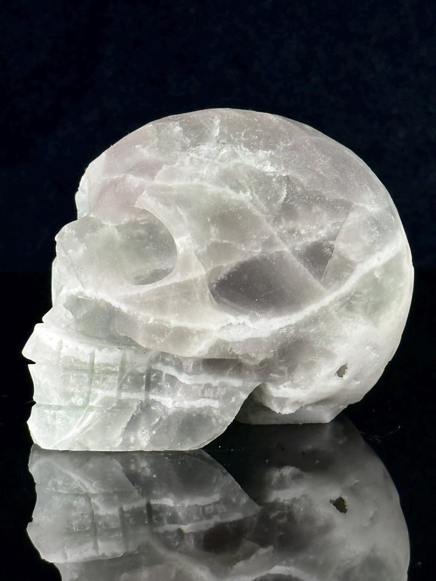 Side profile of green fluorite skull from Brazil