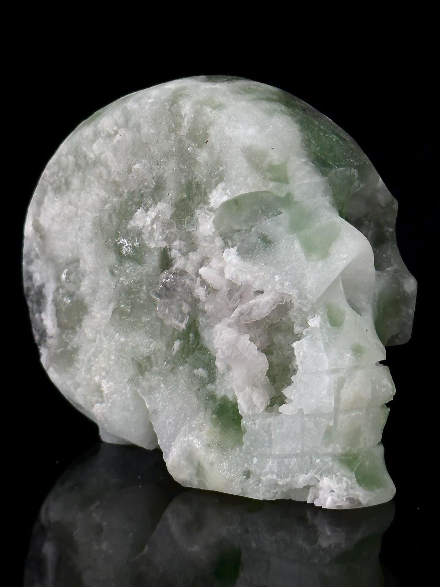 Side view of green fluorite skull, 3.5×2×3 in, China