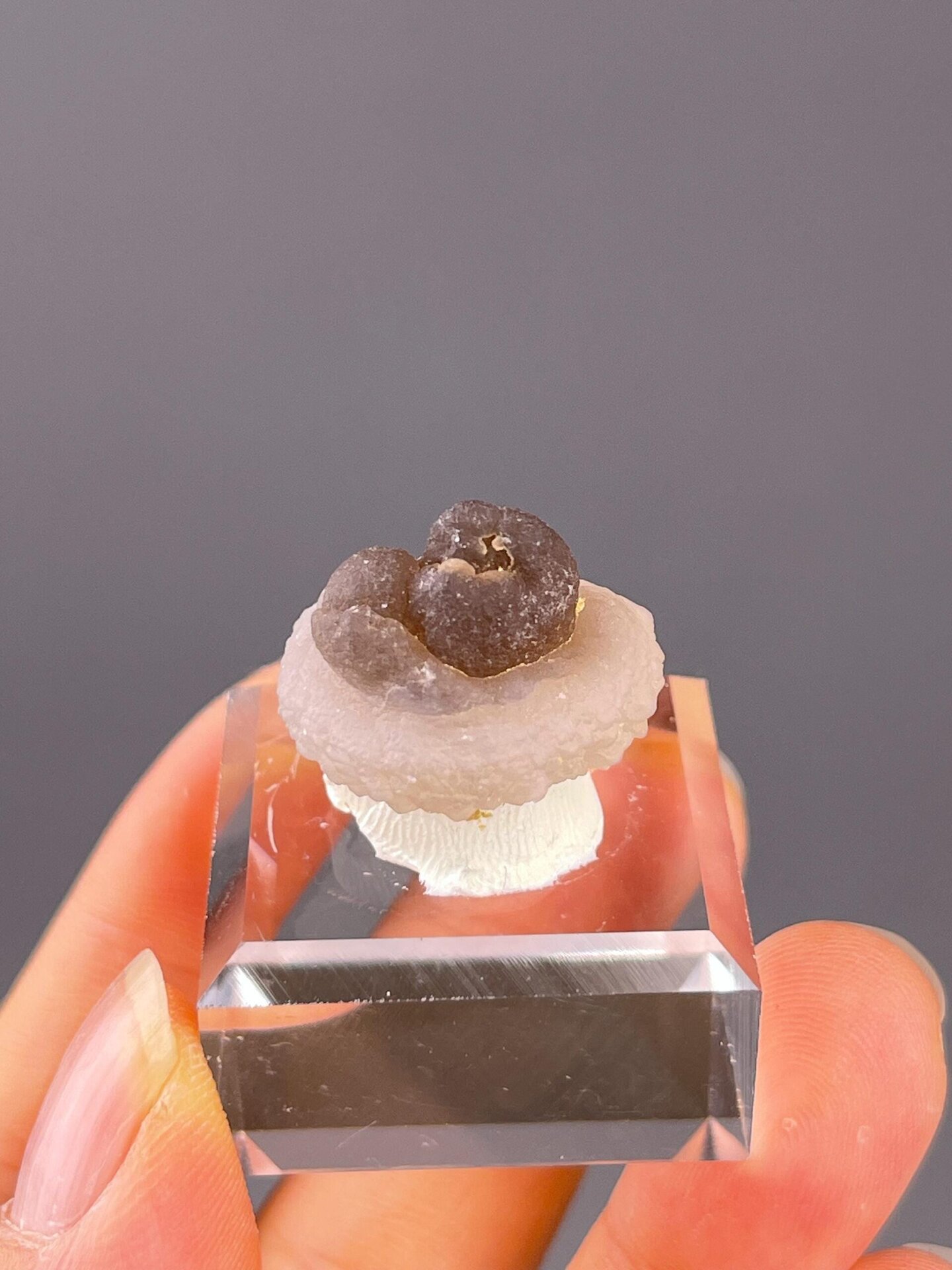 Side view of tiny panda calcite, 0.8×0.6×0.6 in, China