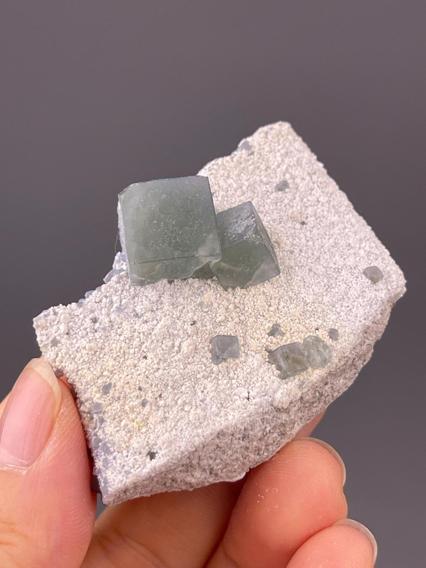 Morandi green cubic fluorite on sandy matrix from Inner Mongolia, China
