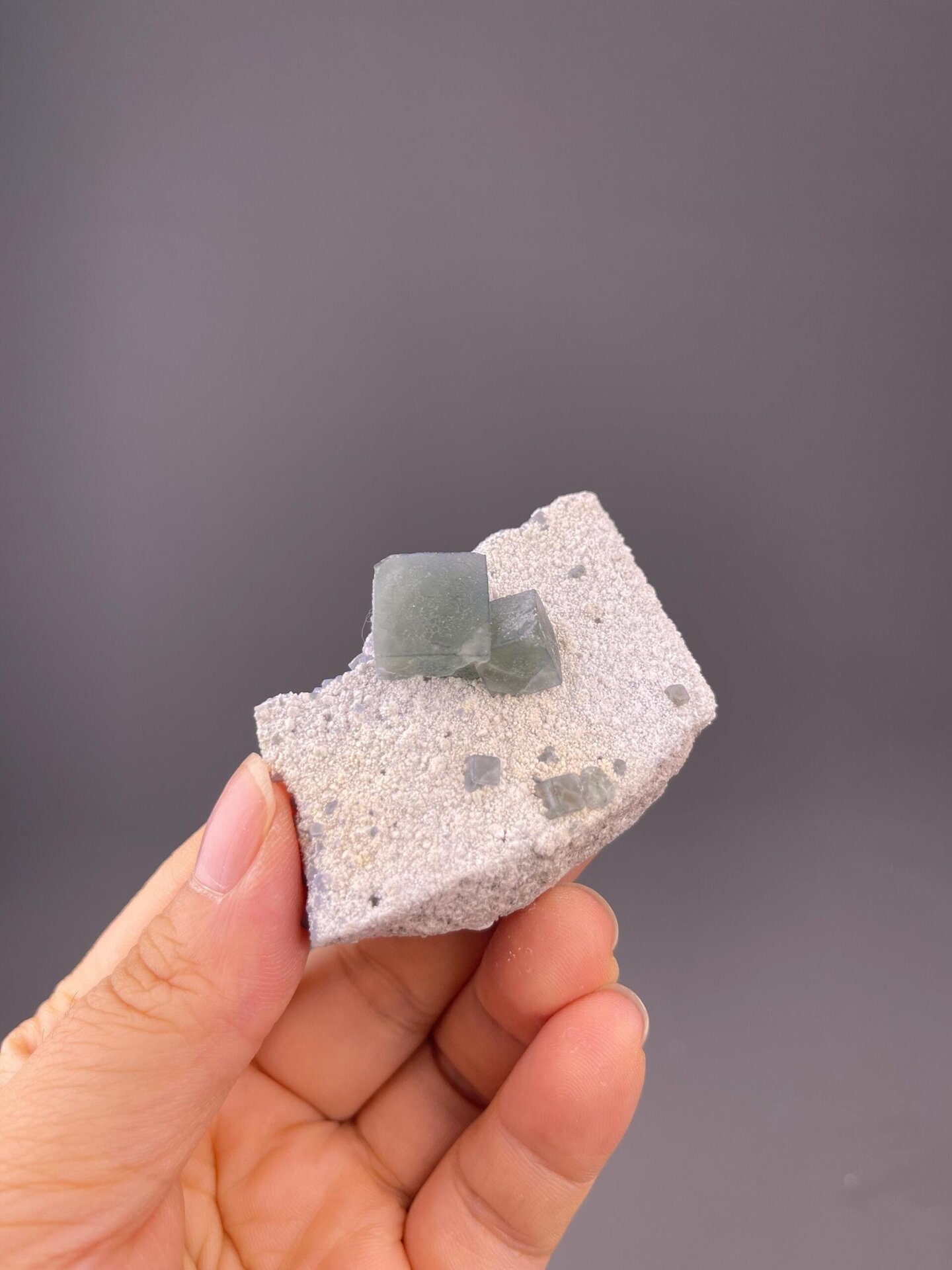 Front view of green cubic fluorite cluster, 2.1×1.7×0.7 in