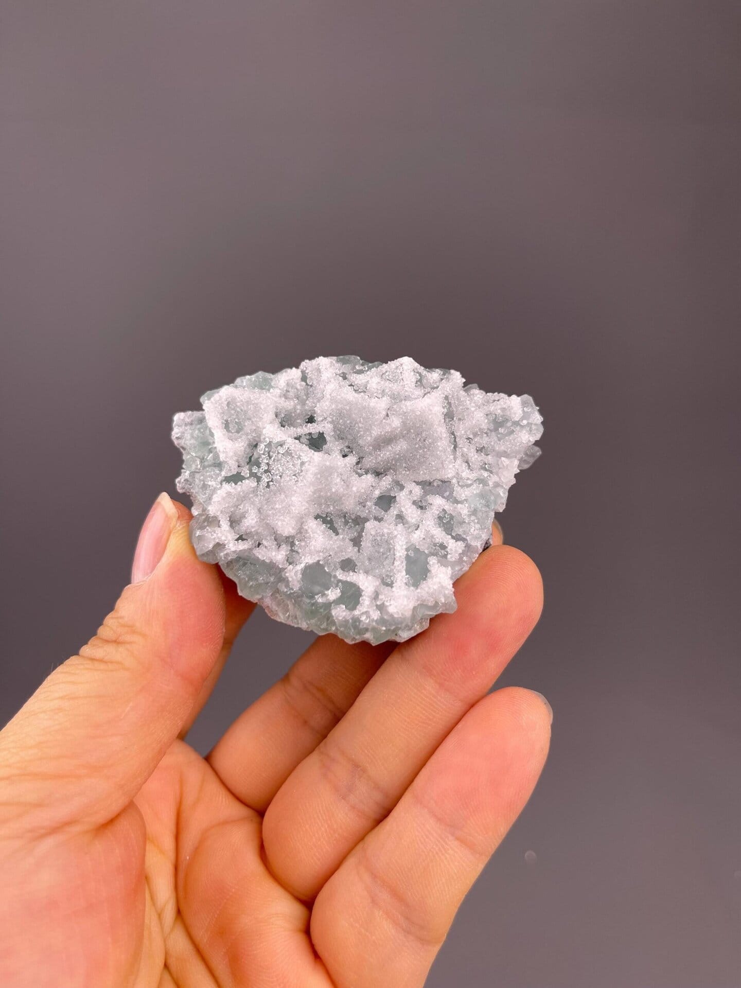 Front view of green fluorite with druzy quartz coating, 2.2×1×1.7 in
