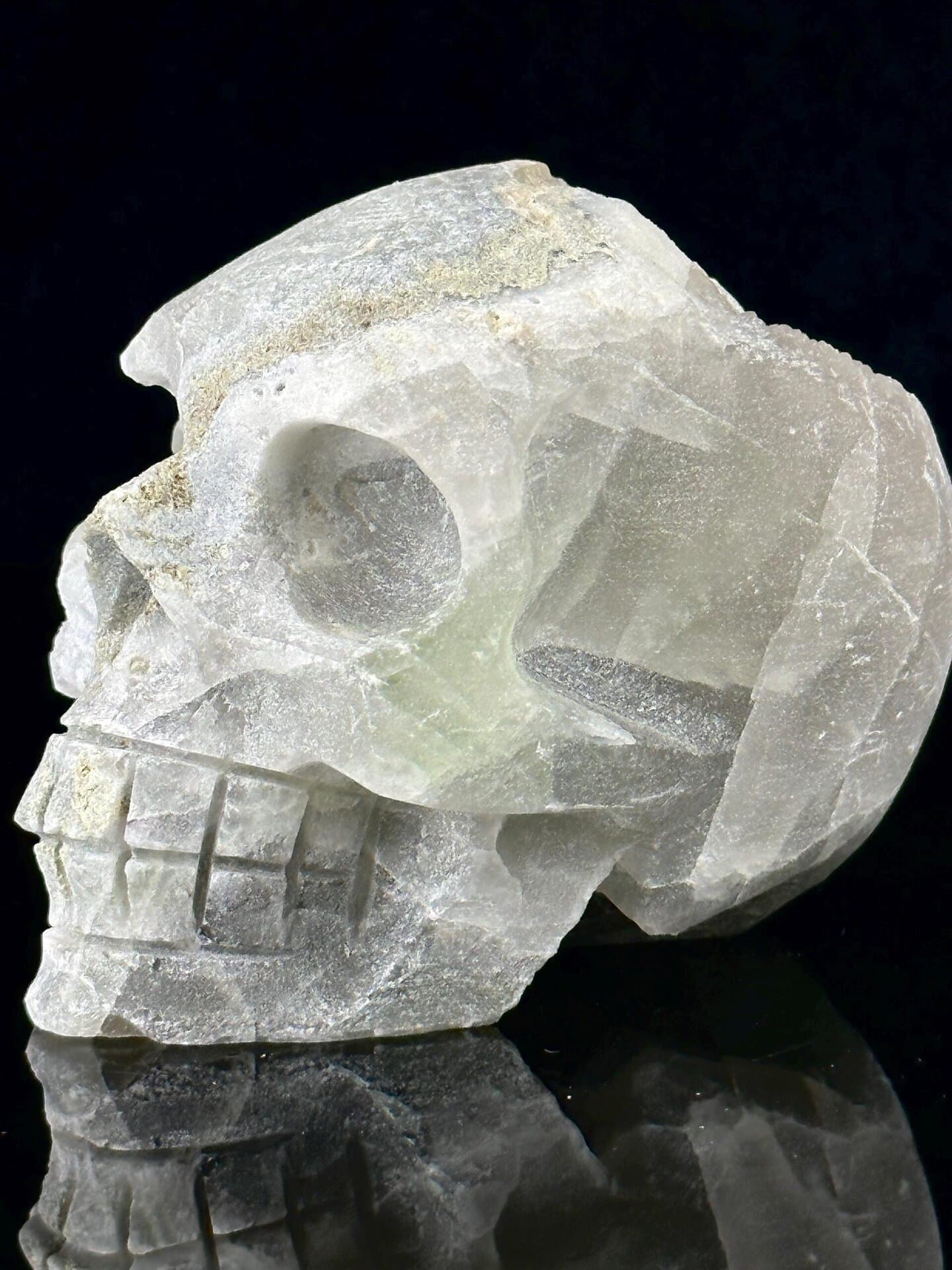 Front view of hand-carved fluorite skull showing carving detail