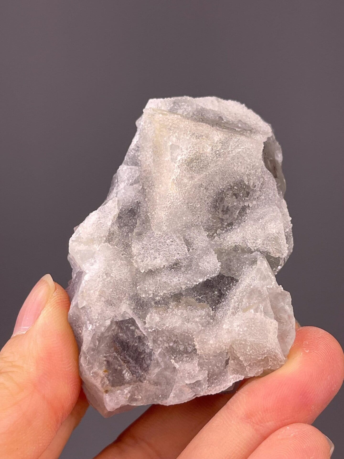 Side view of blue fluorite showing etched surfaces