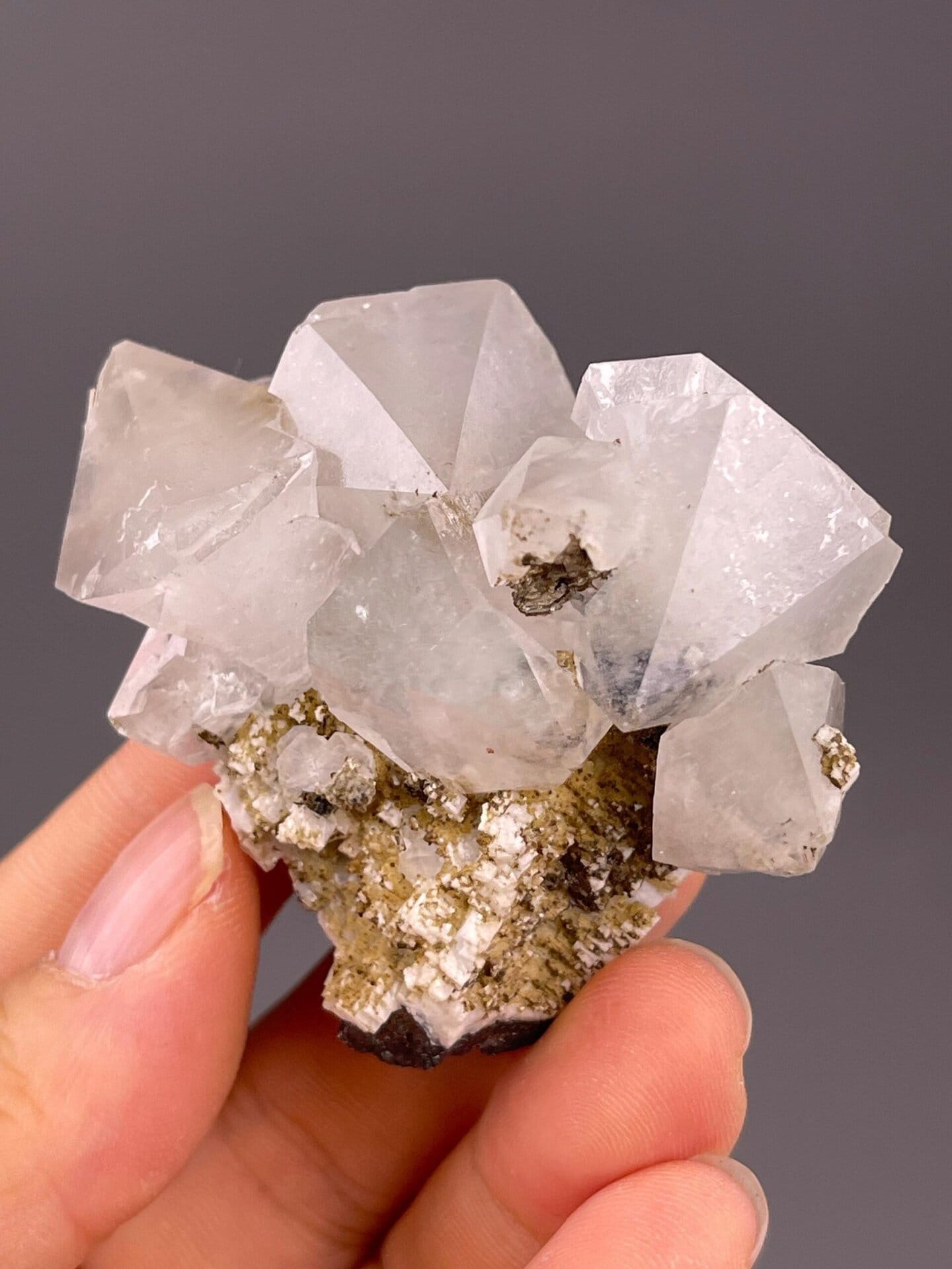 Close-up of white fluorite octahedron showing sharp edges
