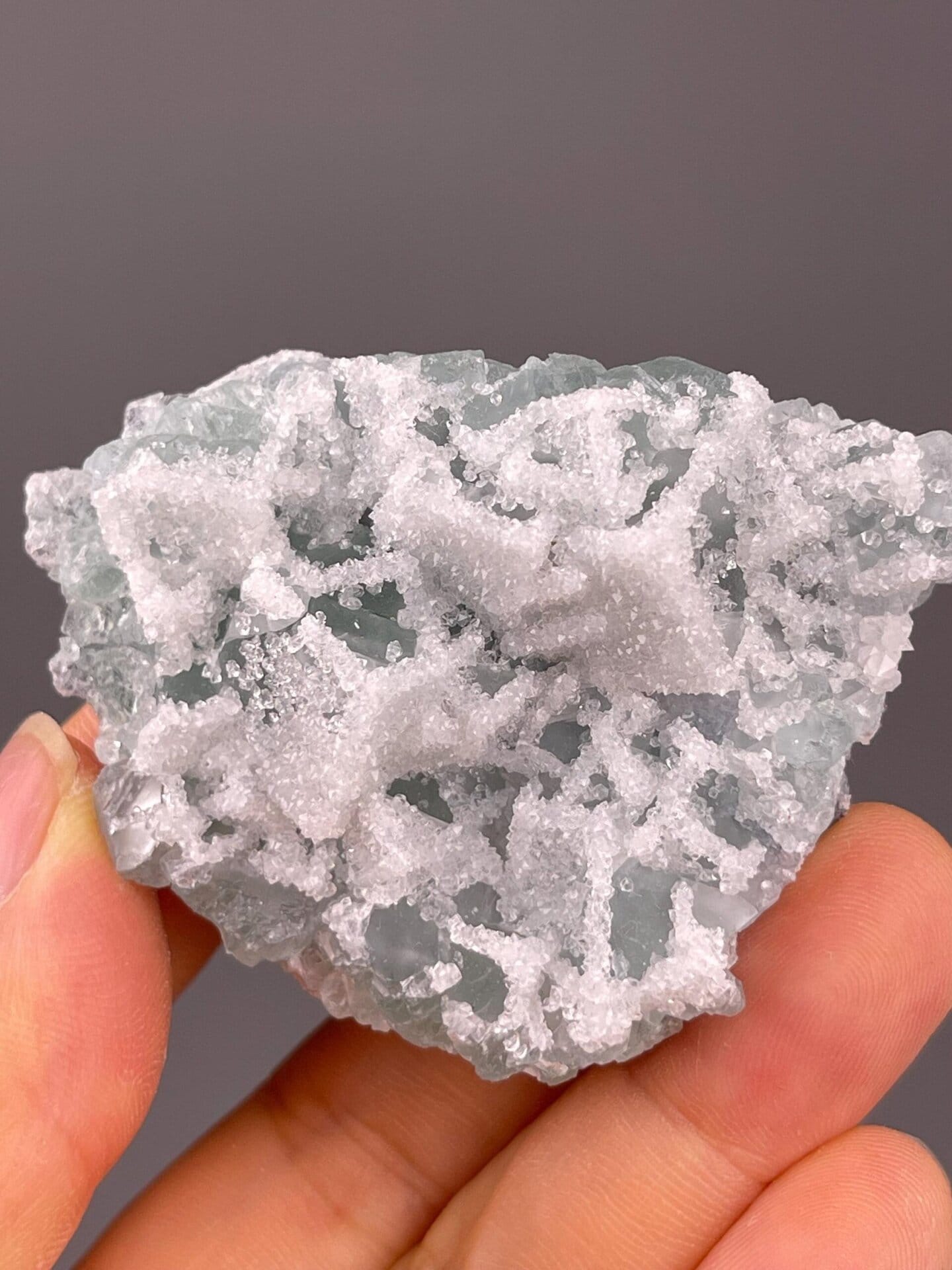 Close-up of druzy quartz microcrystals on green fluorite