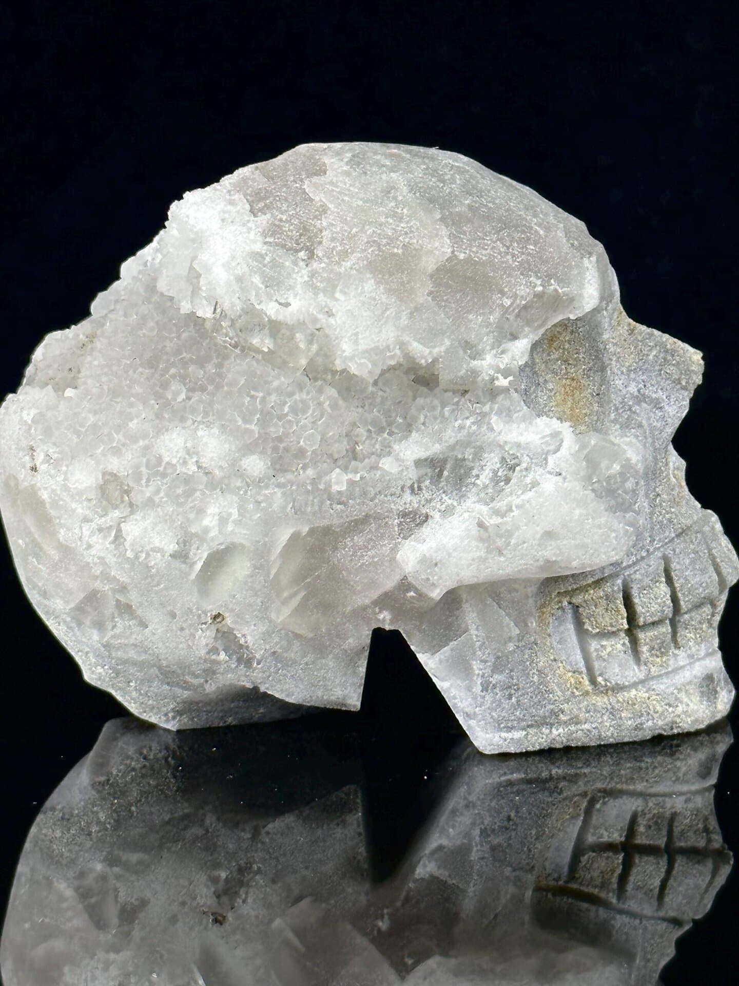 CaF₂ cubic fluorite, Mohs 4, hand-carved skull with quartz geode, 104 oz